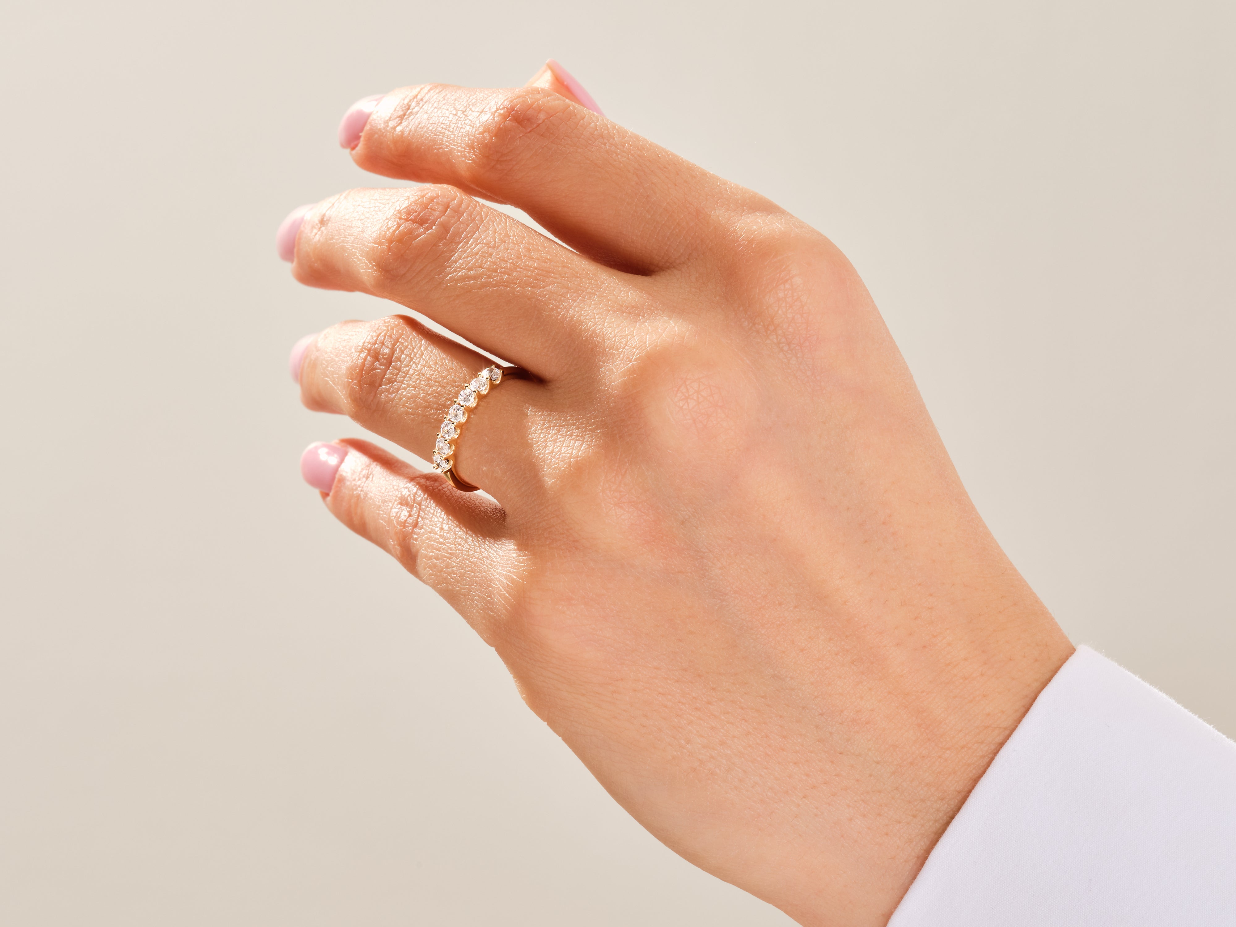 Diamond eternity ring on a woman's hand, jewelry product