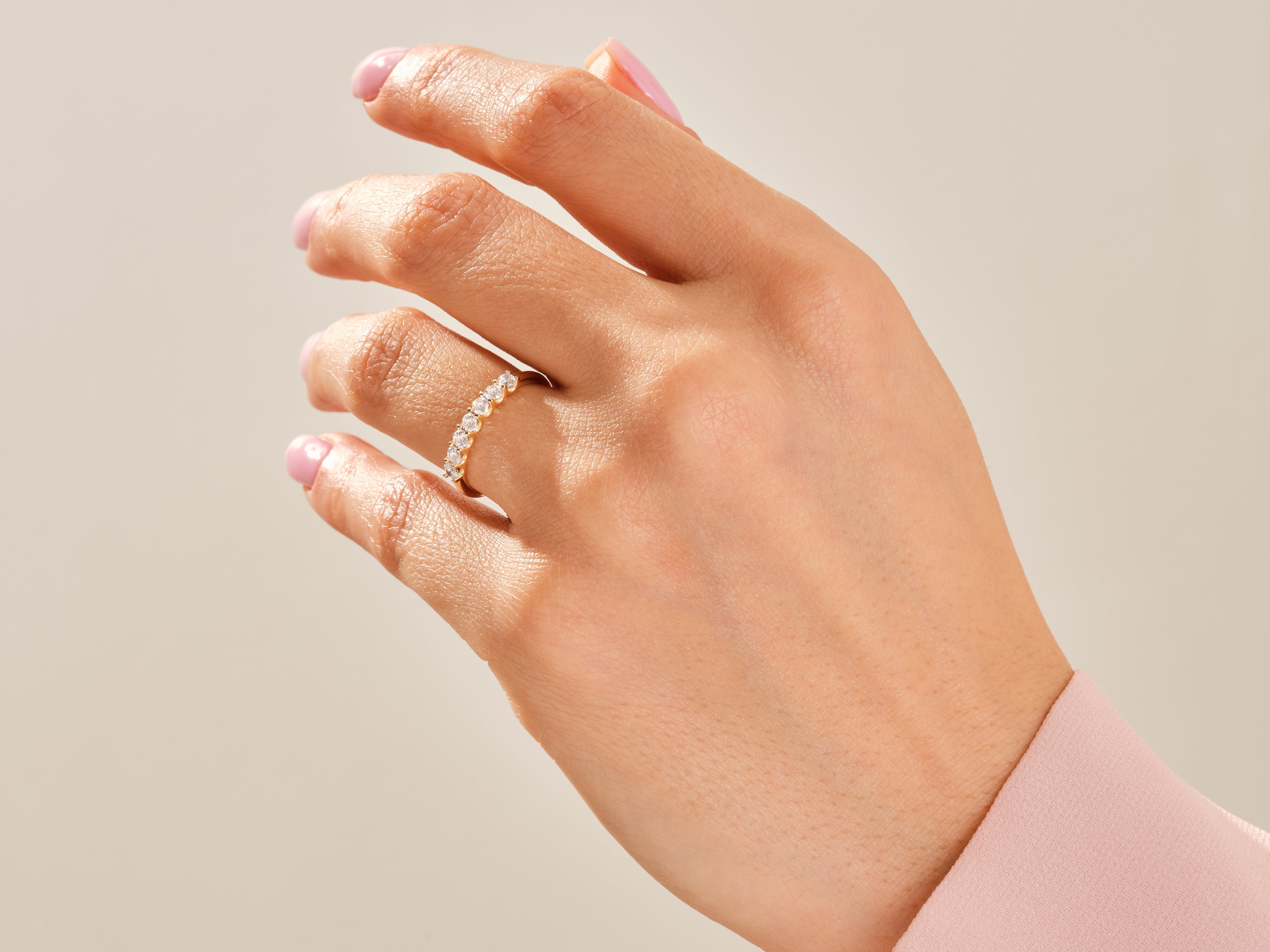 Diamond band ring on a hand, fine jewelry for women