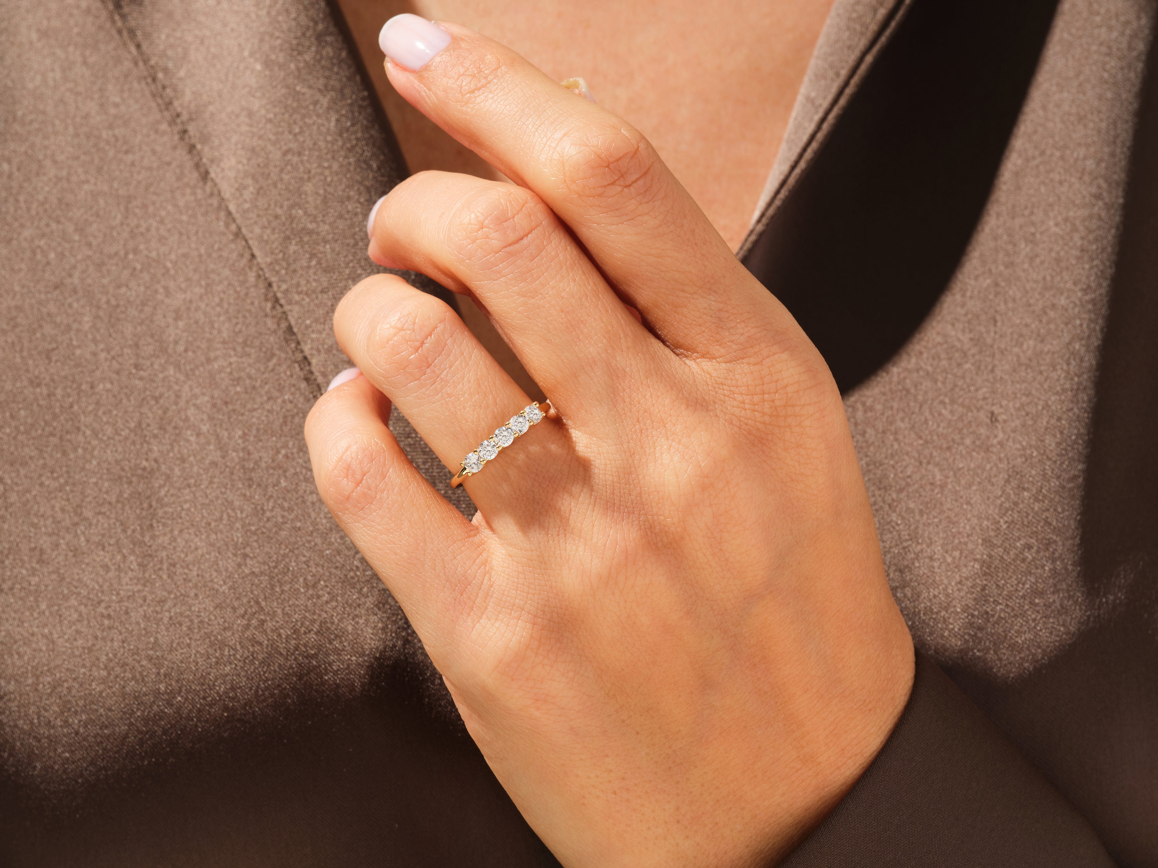 Diamond band ring on a hand, fine jewelry for women