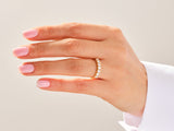 Diamond band ring on a woman's finger, jewelry
