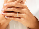 Diamond eternity ring on a woman's hand, jewelry photography