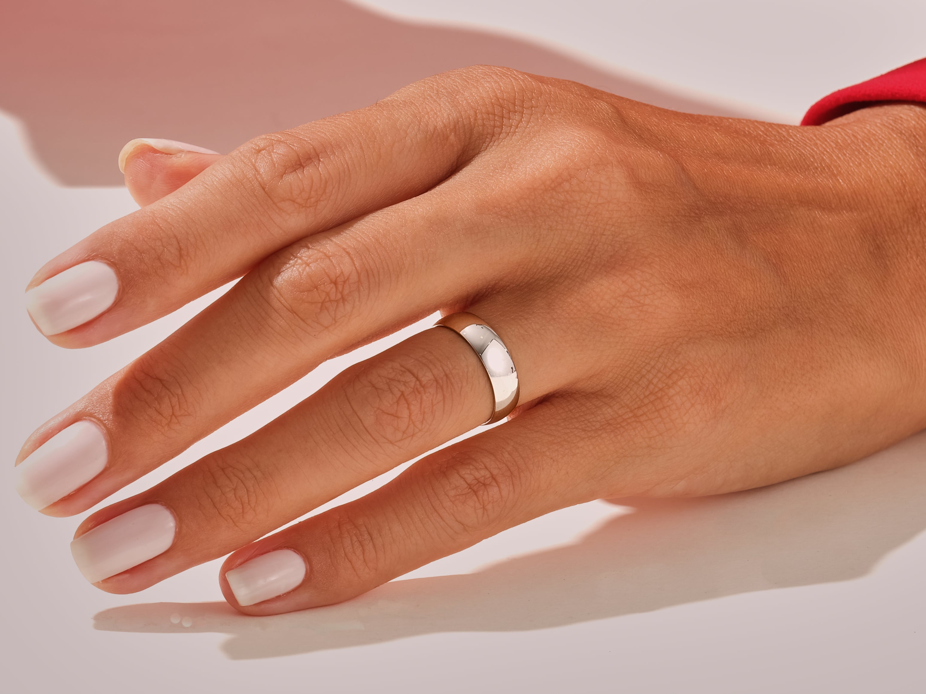 Elegant silver ring on a hand with manicured nails