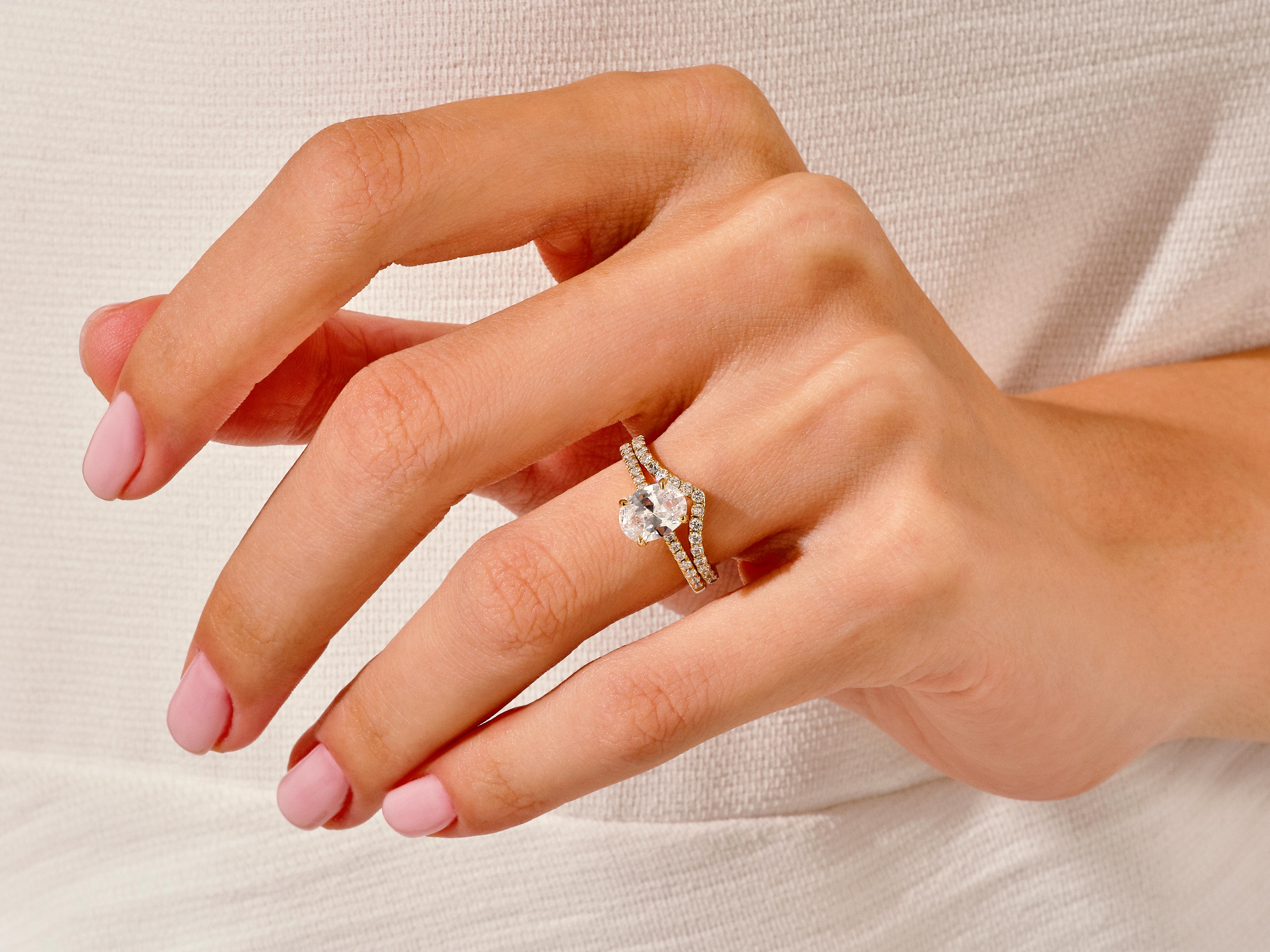 Diamond engagement ring on a woman's hand, jewelry photography