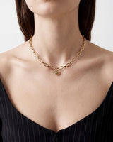 Sunface Charm worn by a model