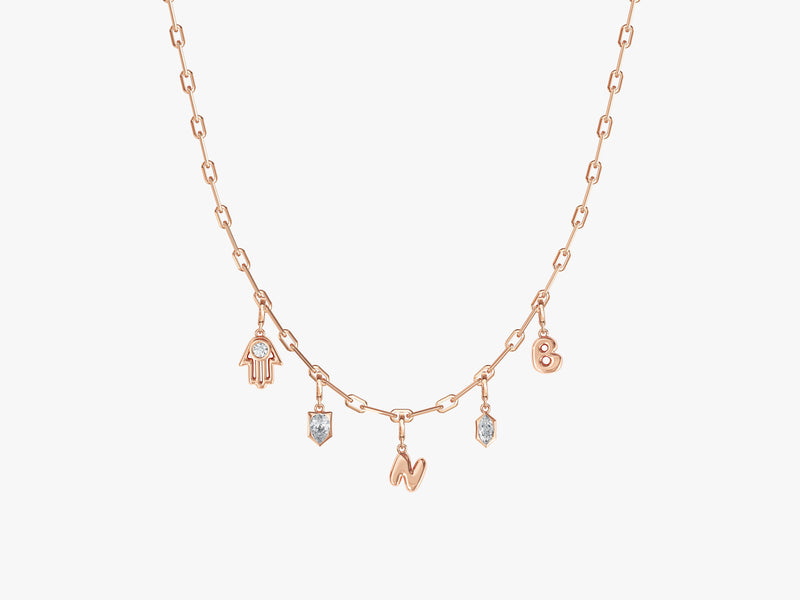 Rose gold necklace with diamond charms and initial pendants