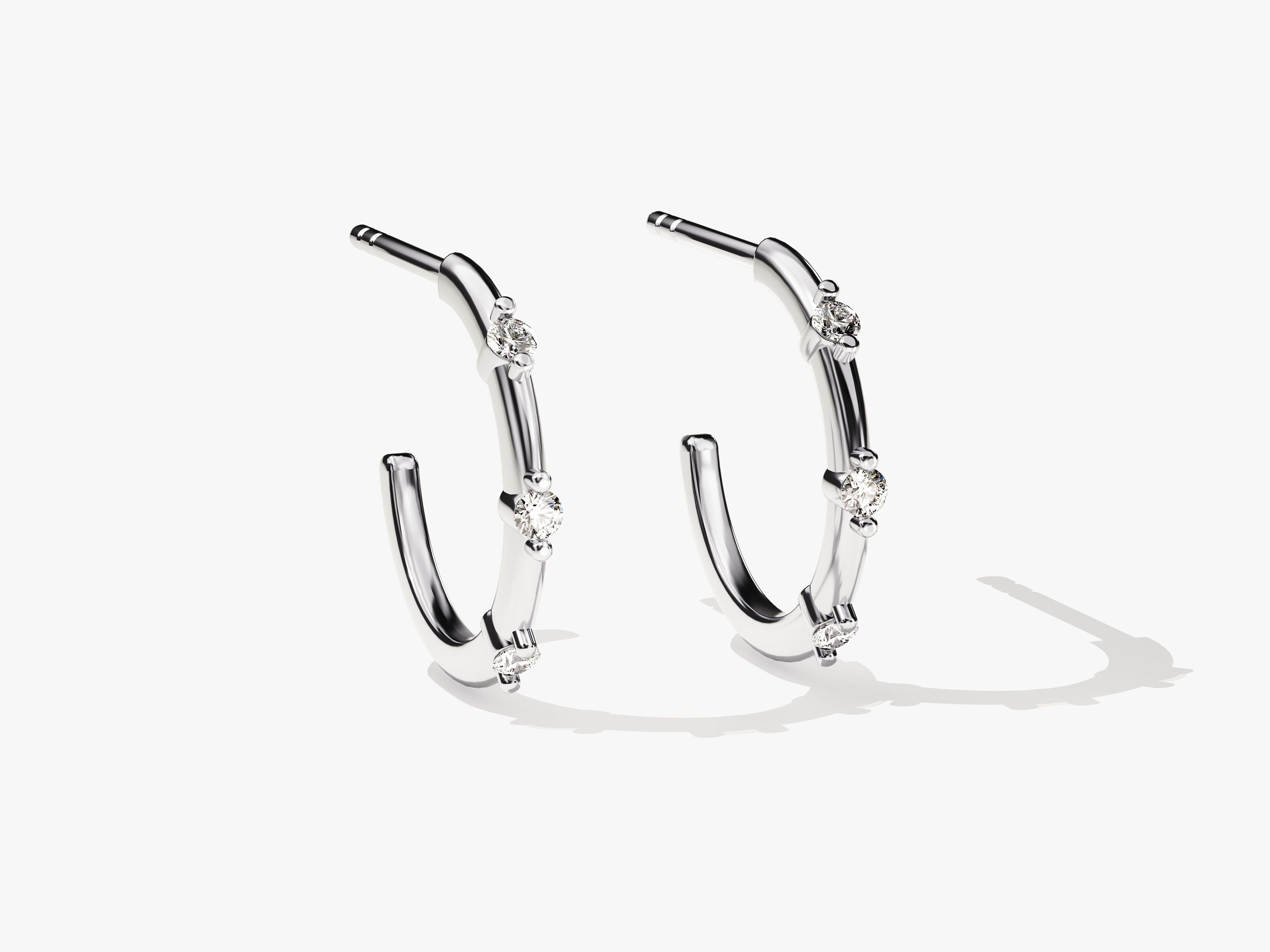 Diamond hoop earrings, fine jewelry, elegant, modern, silver, luxury