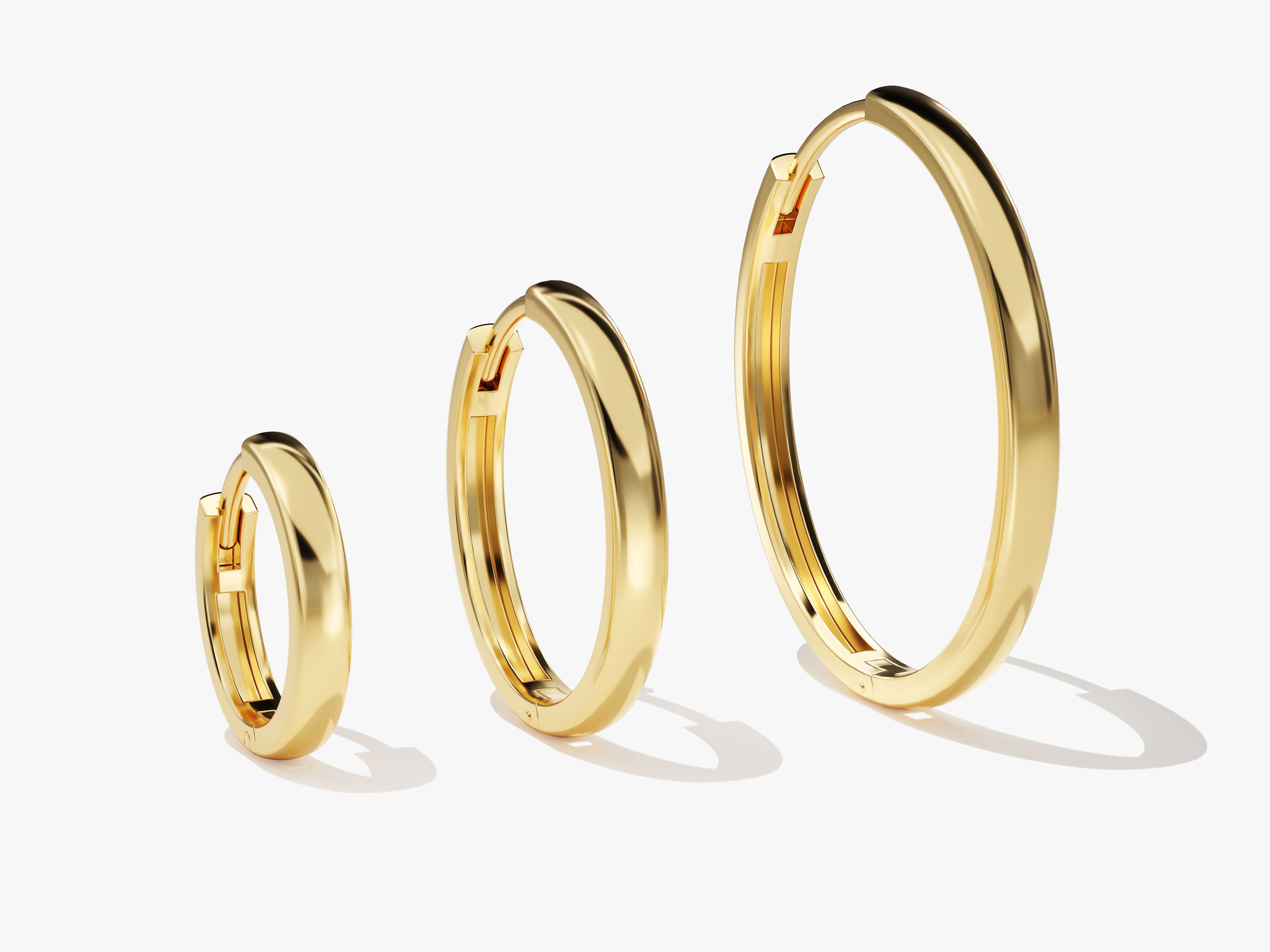 Gold hoop earrings in three sizes from jewelry firm