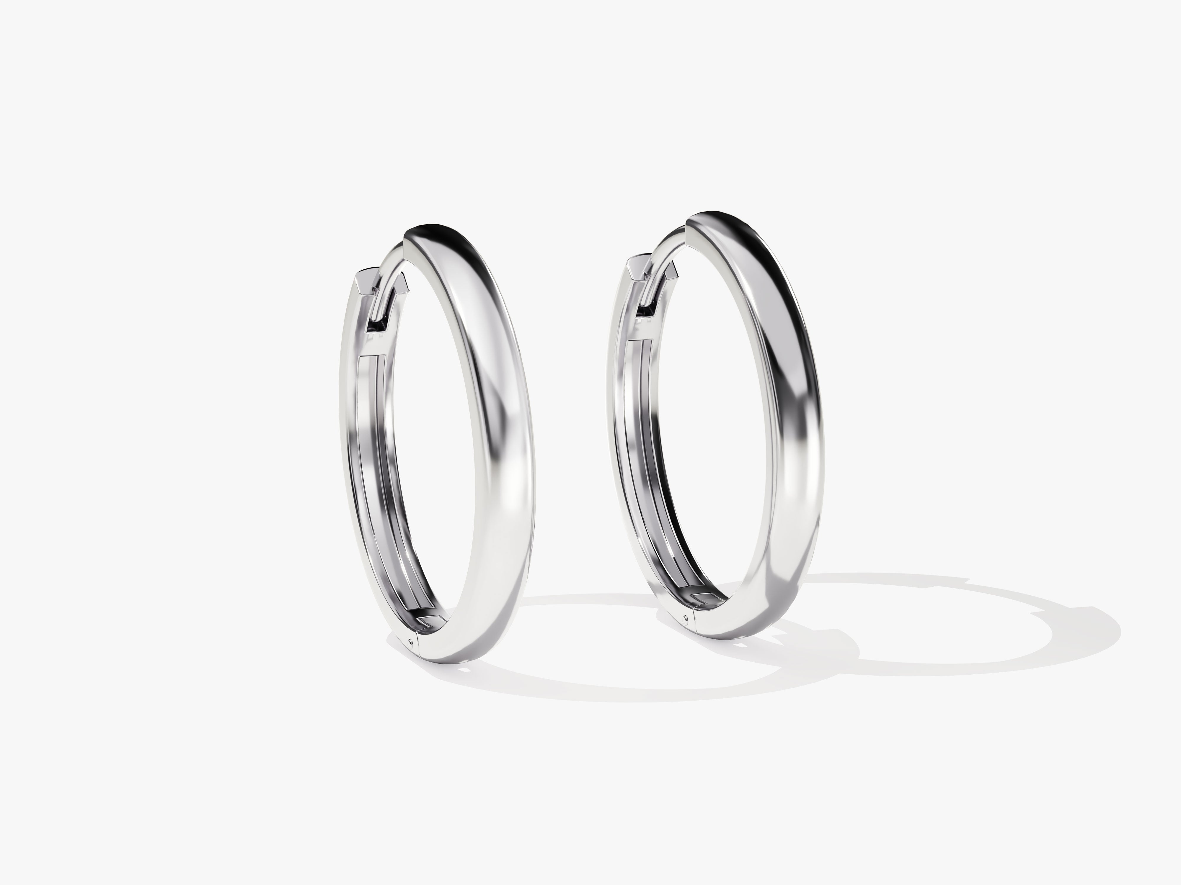 Sleek silver hoop earrings from a jewelry collection