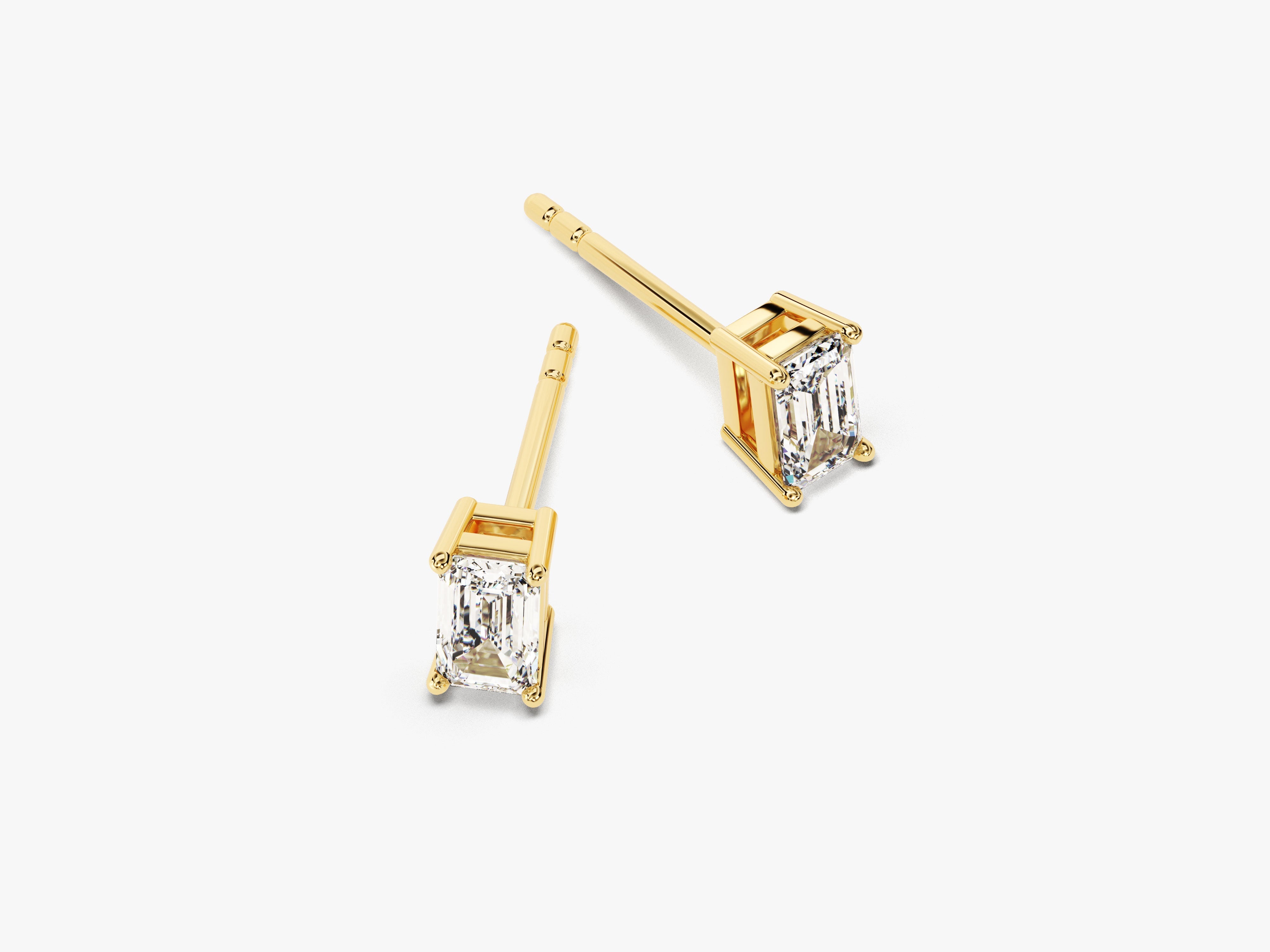 Emerald cut diamond stud earrings in yellow gold