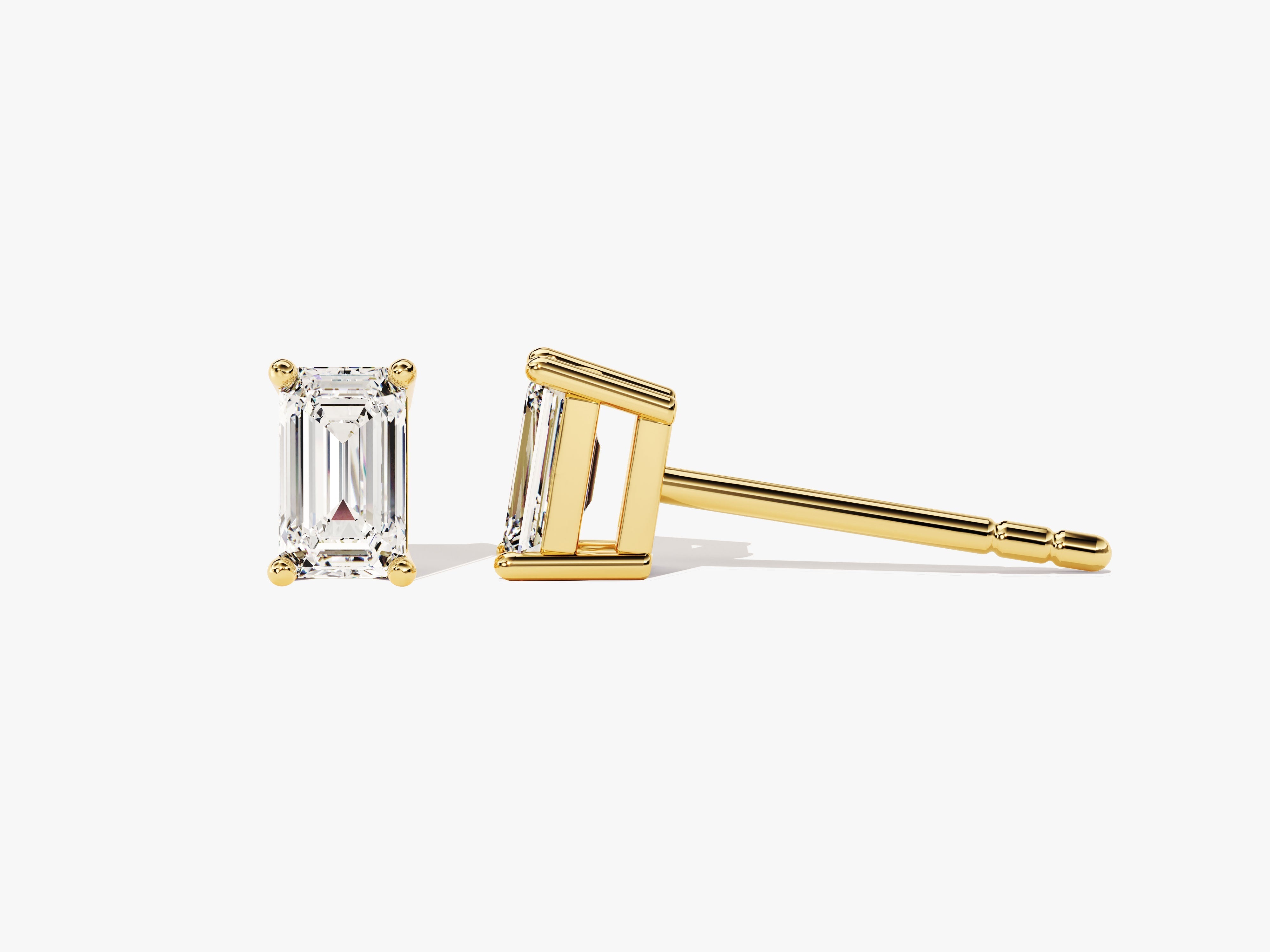 Emerald cut diamond stud earrings in yellow gold