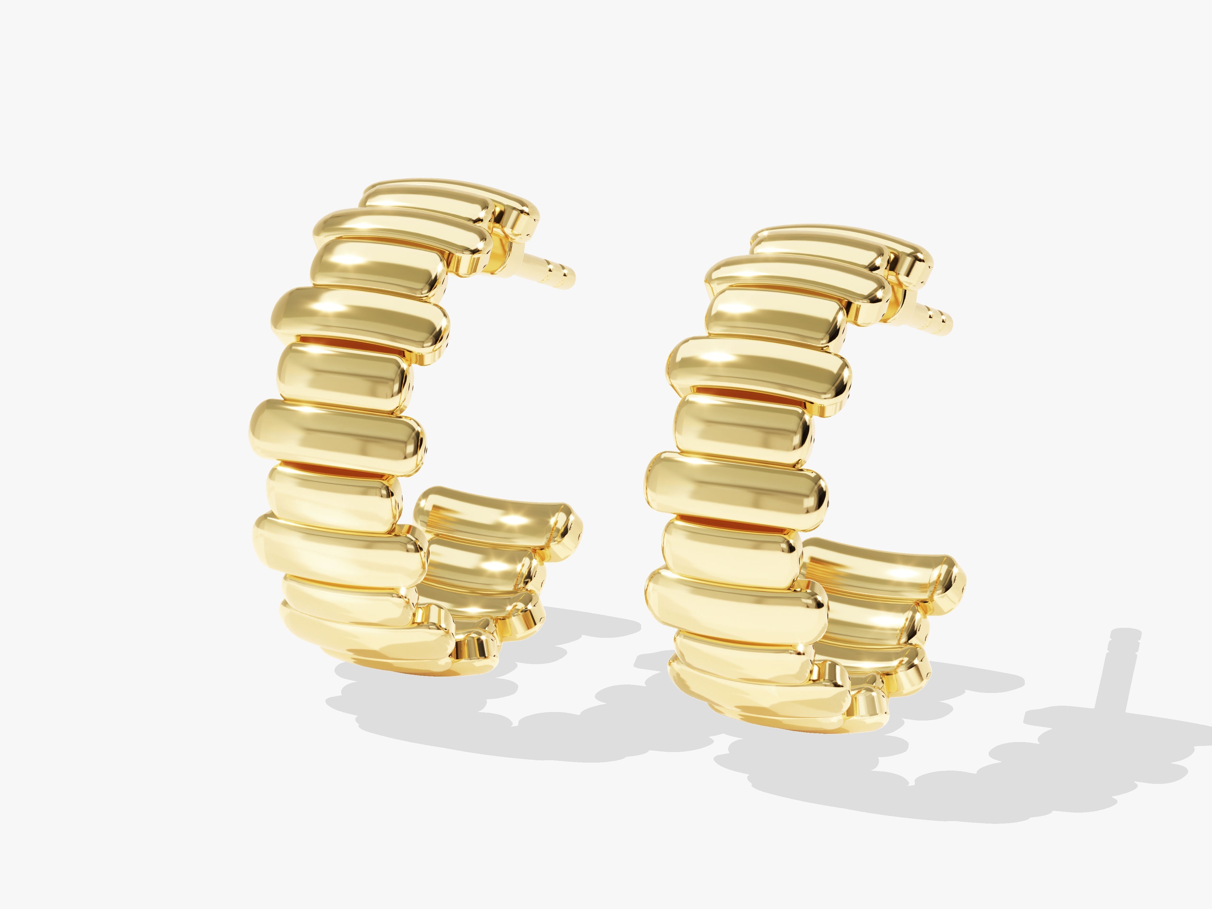 Gold hoop earrings with a unique segmented design