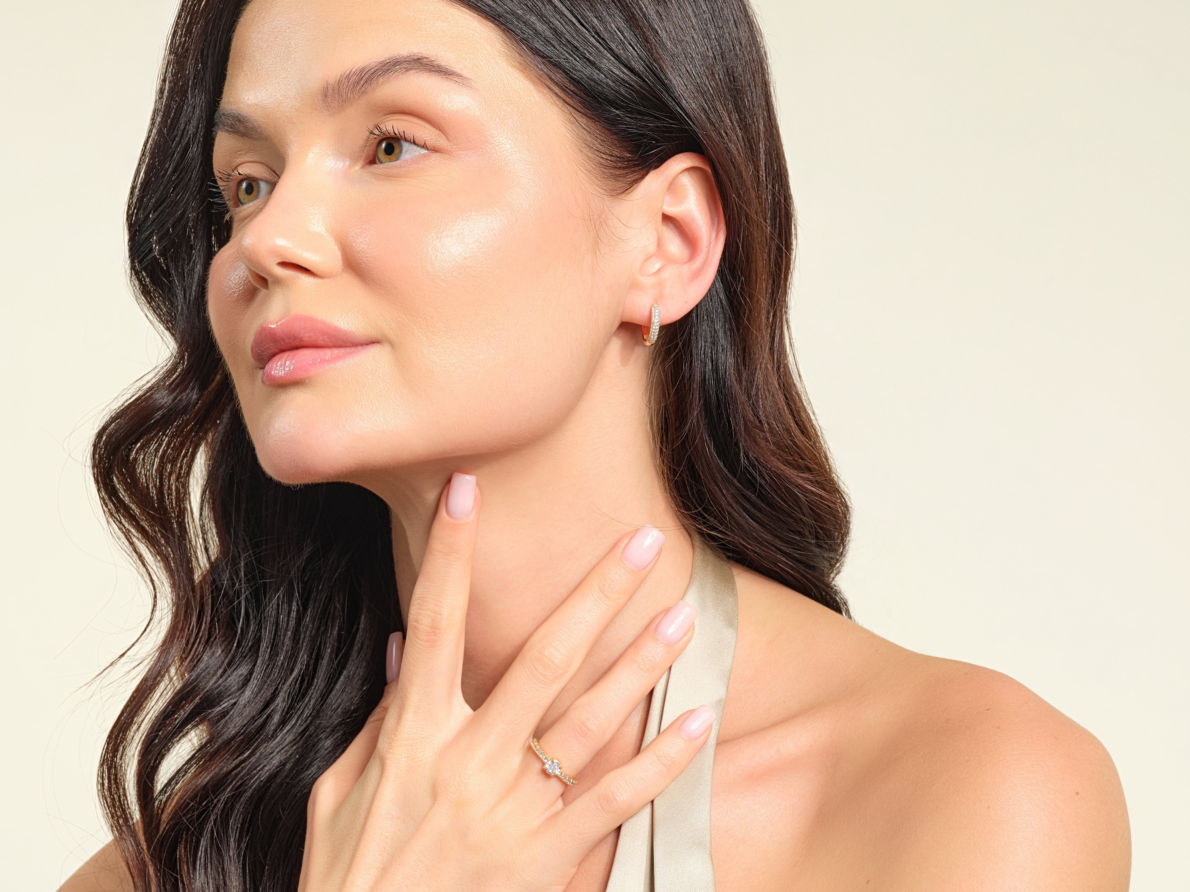 Diamond earrings and ring on elegant woman, jewelry photography