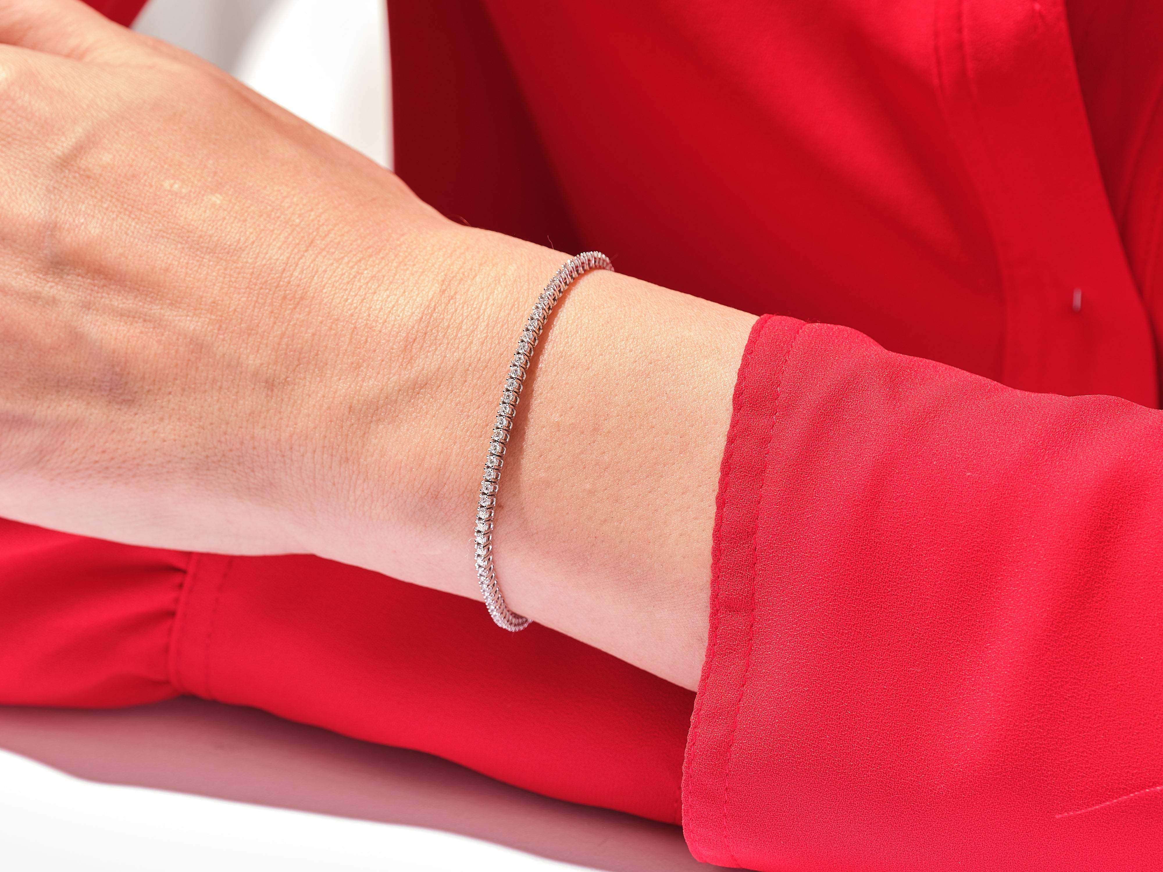 Diamond tennis bracelet on a woman's wrist, jewelry