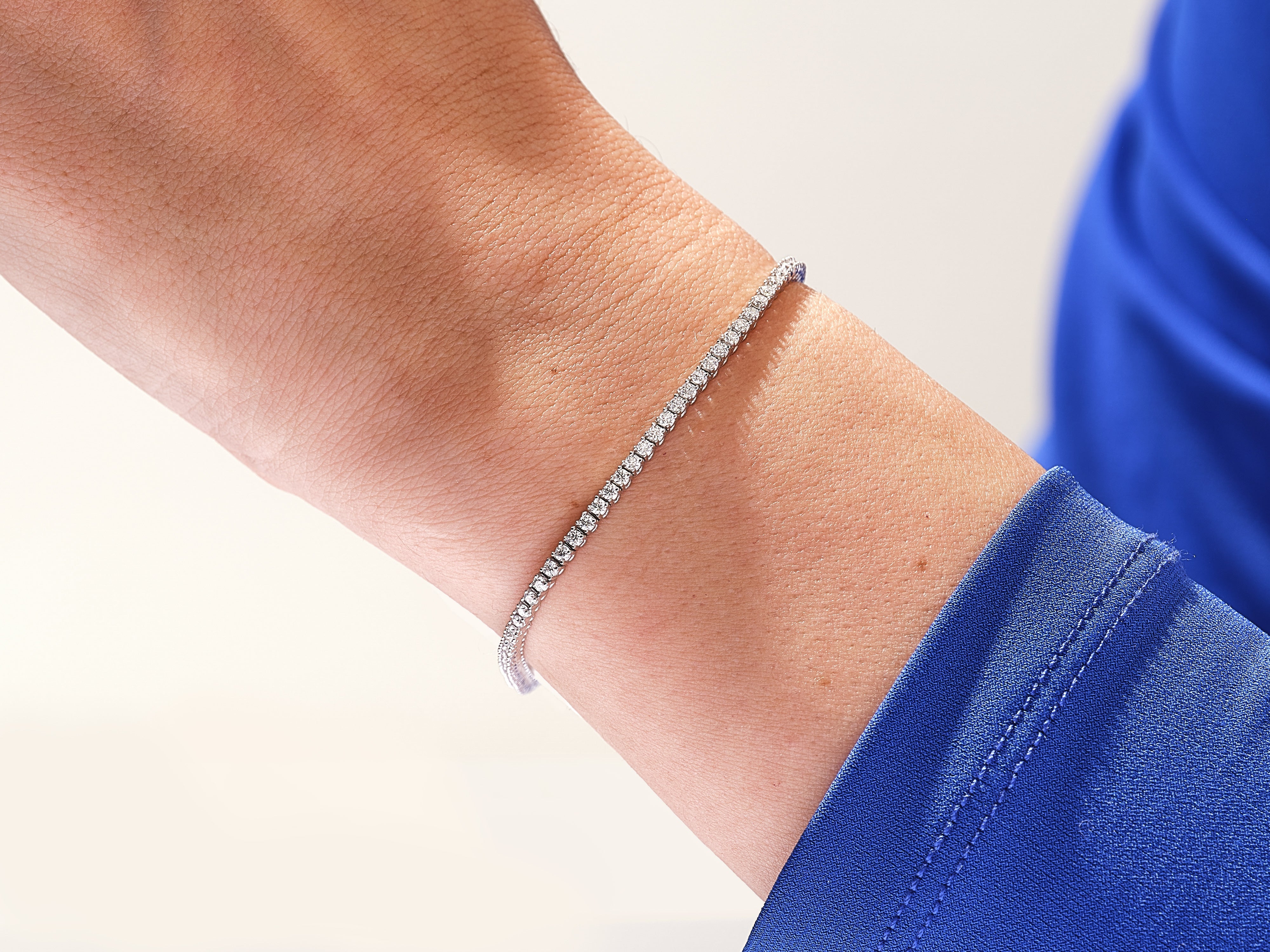 Diamond tennis bracelet on a wrist, fine jewelry for women