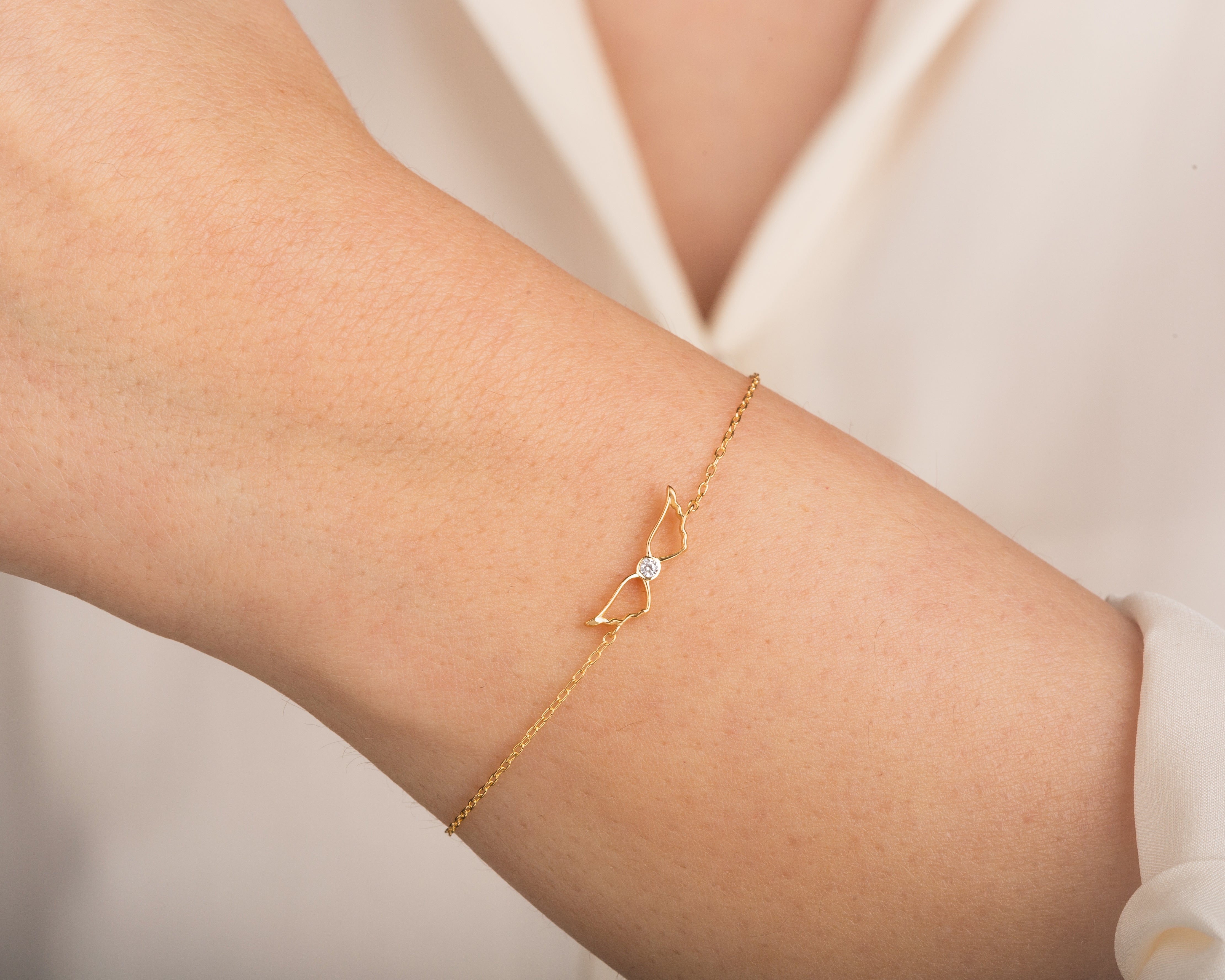 Yellow, White, Rose, 5 Inches, 5.5 Inches, 6  Inches, 6.5 Inches, 7 Inches, 7.5 Inches, 8 Inches, 14k Gold Diamond Angel Wings Bracelet on a Woman's Wrist