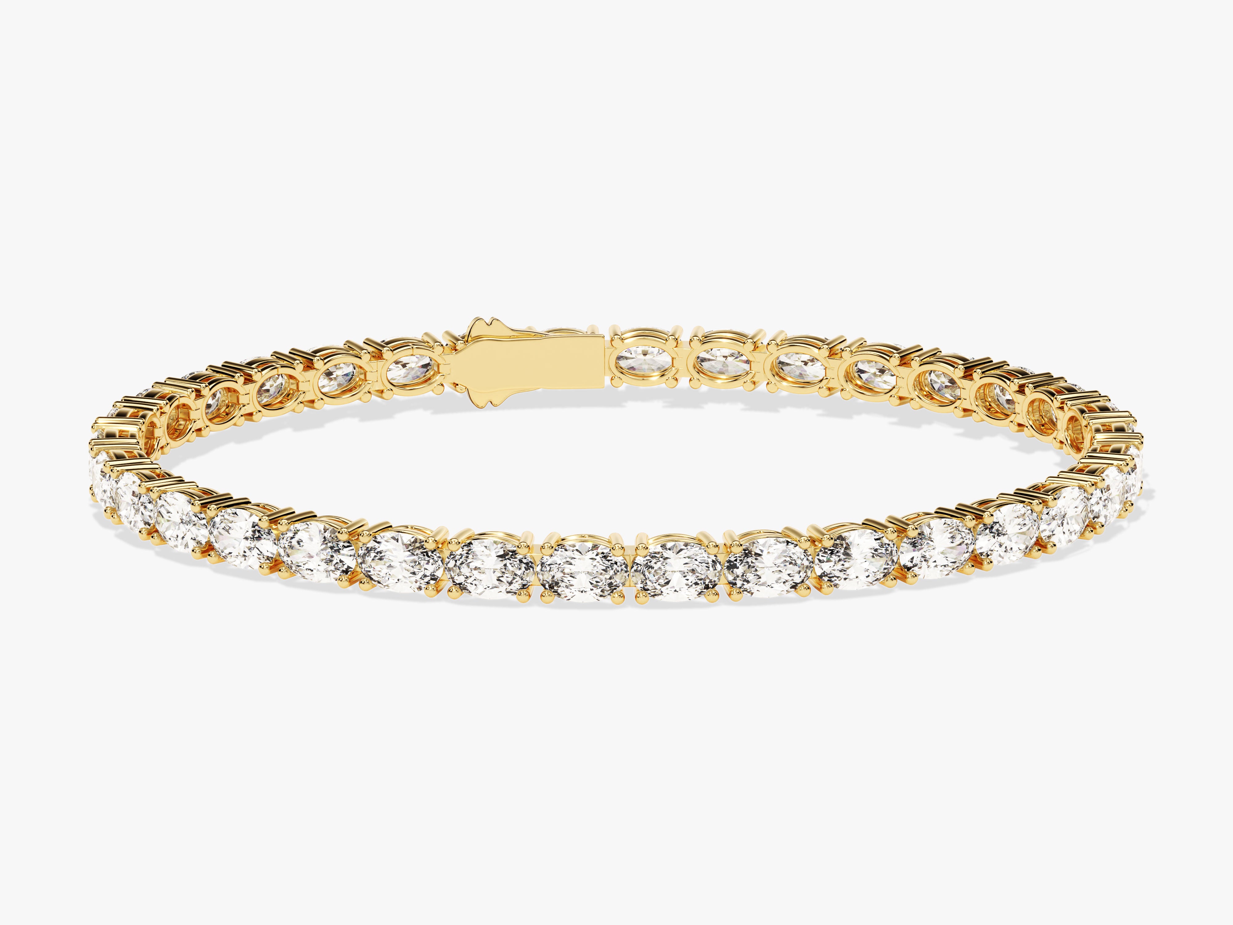 Gold tennis bracelet with oval diamonds