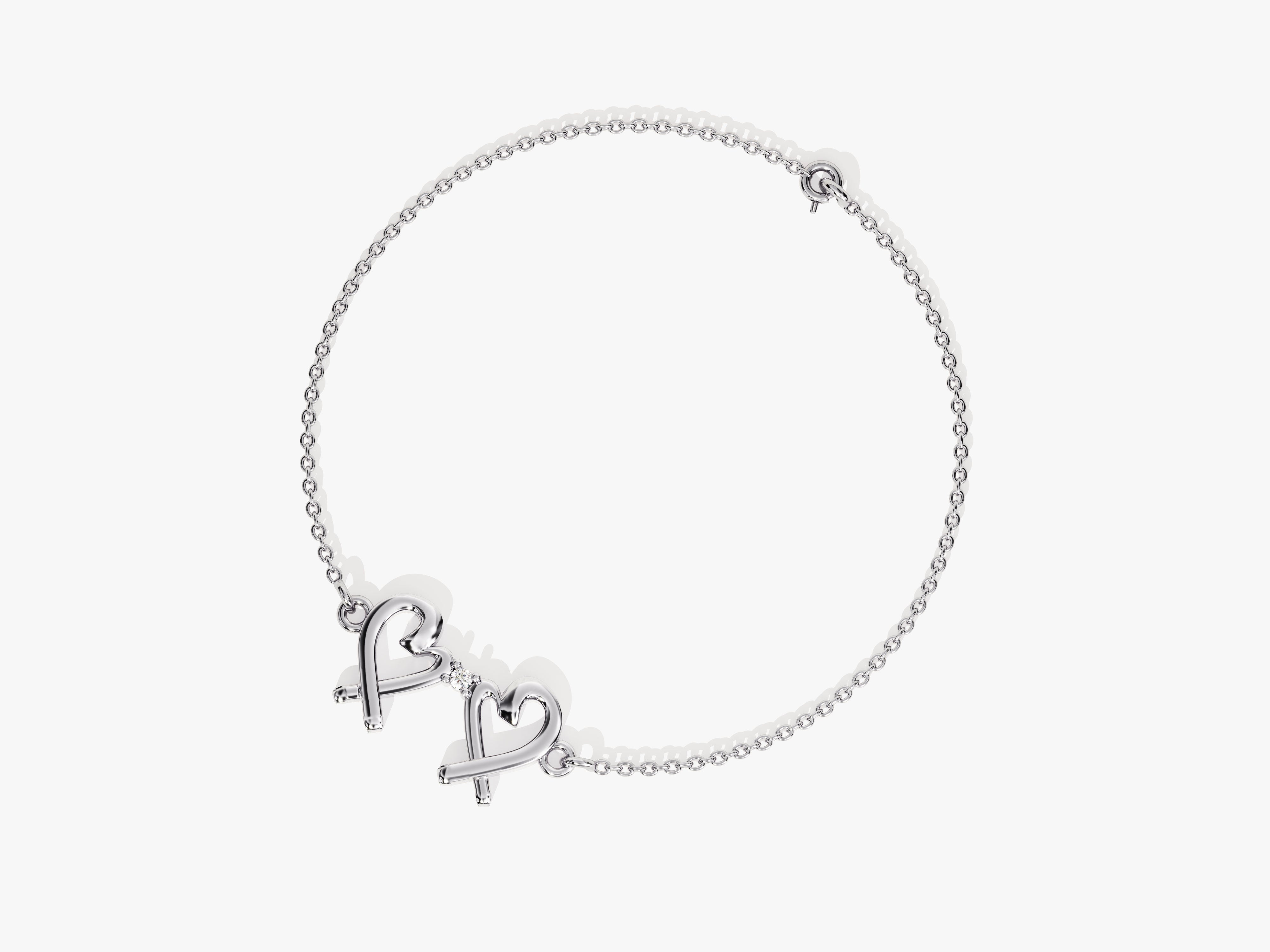Silver bracelet with double heart charm and diamond accent