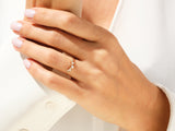 Diamond cluster ring on a woman's hand