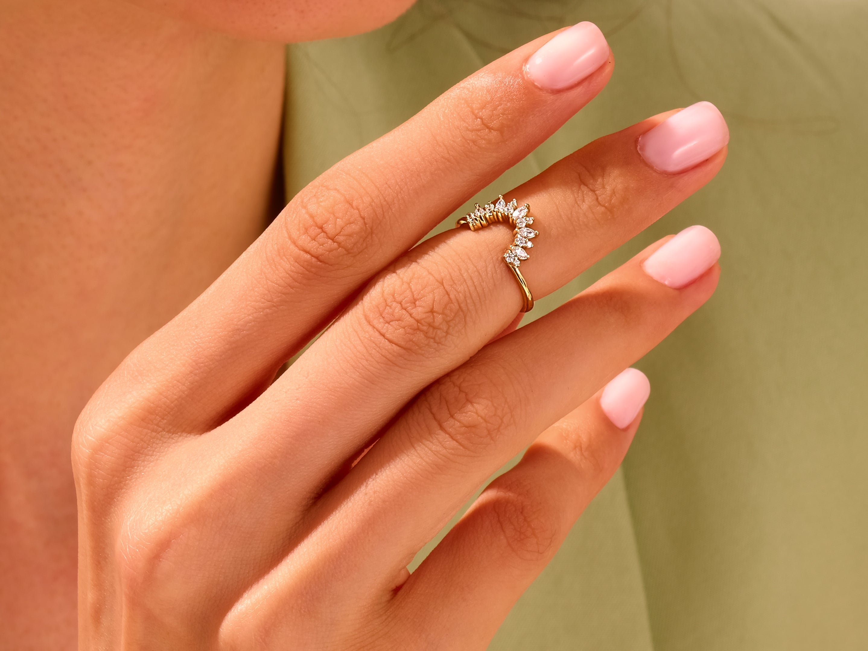 Gold diamond marquise ring on a hand, jewelry