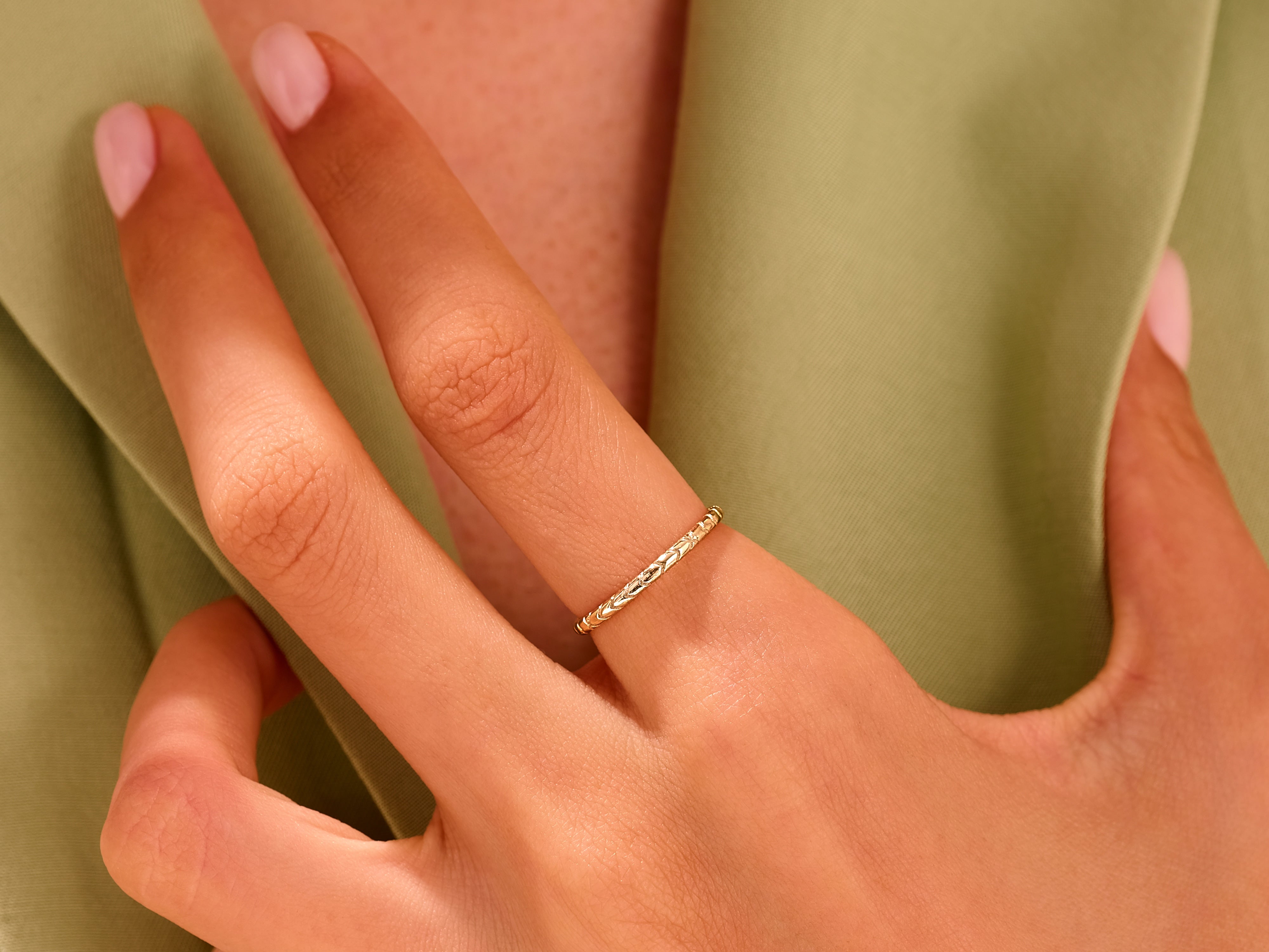 Delicate gold ring on a hand, perfect for jewelry lovers