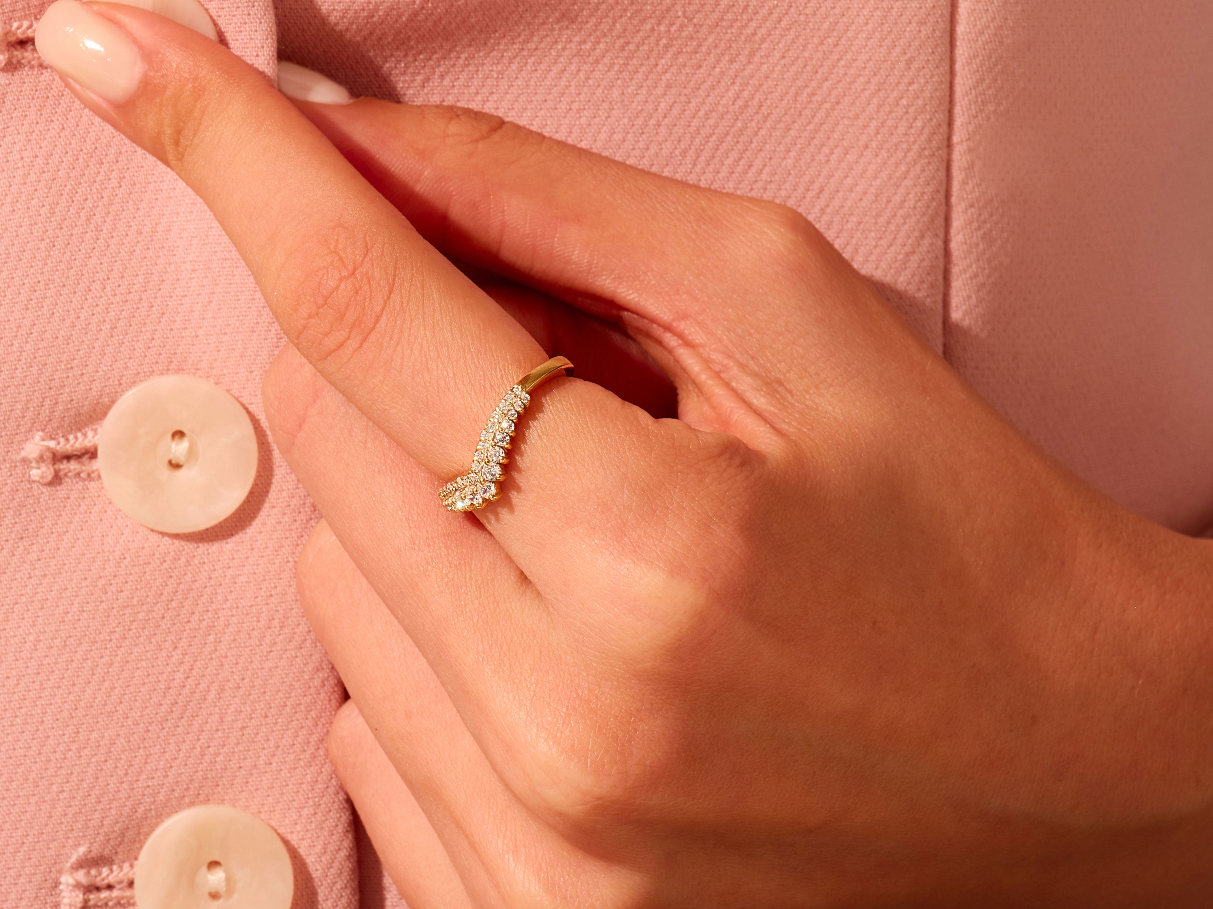Gold diamond ring on a hand, jewelry product photography