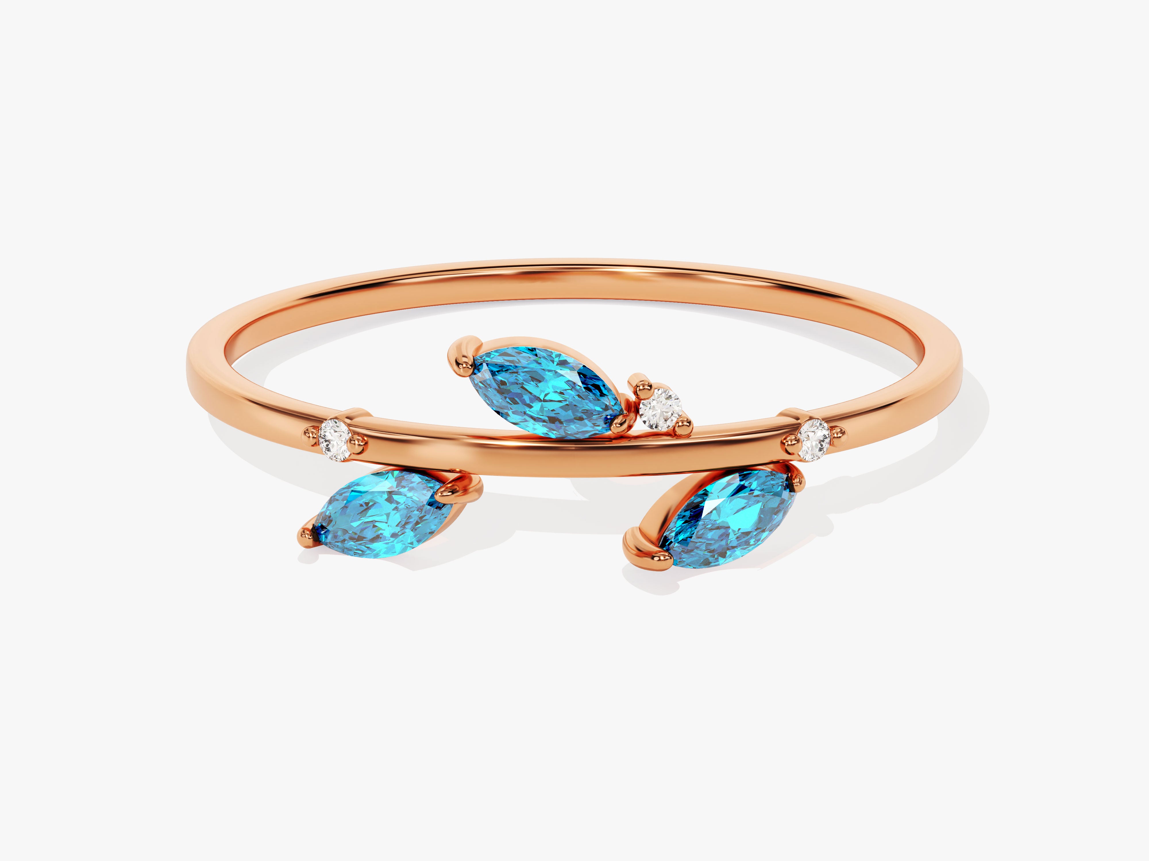 Rose gold ring with marquise blue topaz and diamond accents