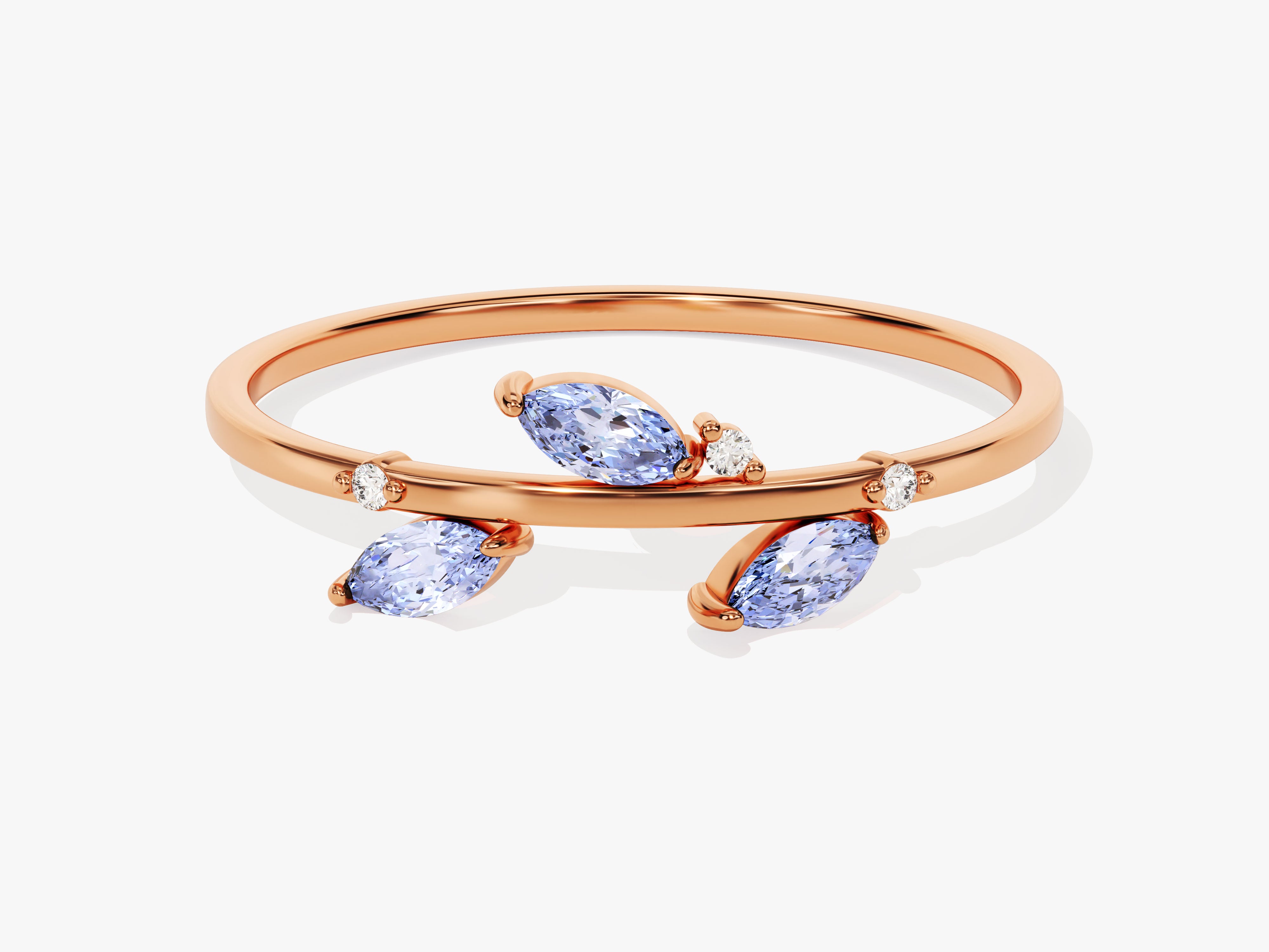 Rose gold ring with marquise blue gems and diamonds