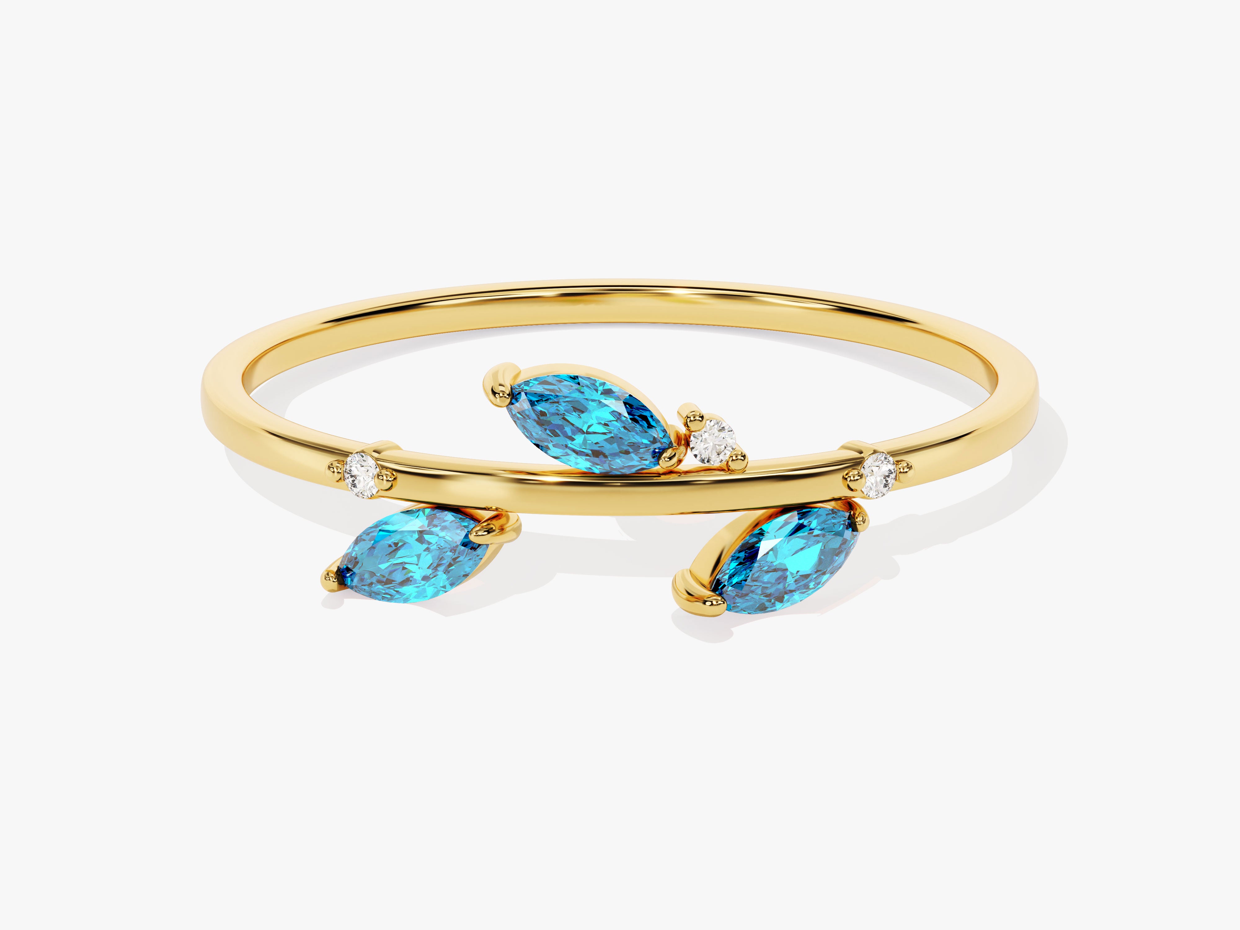 Gold ring with marquise blue topaz and diamond accents