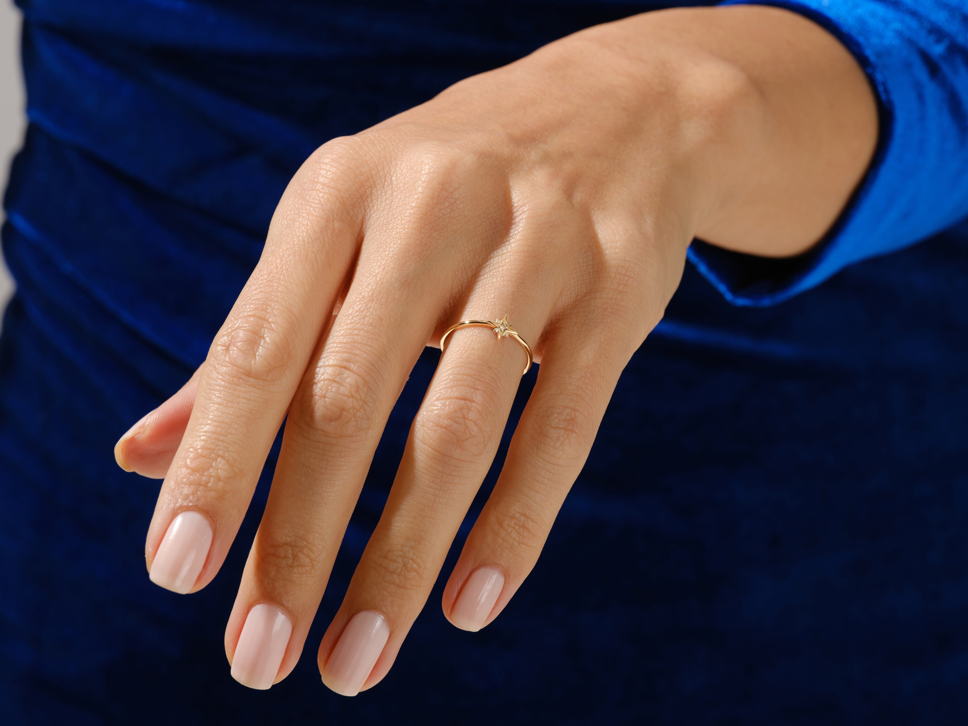 Diamond star ring on a woman's hand, fine jewelry