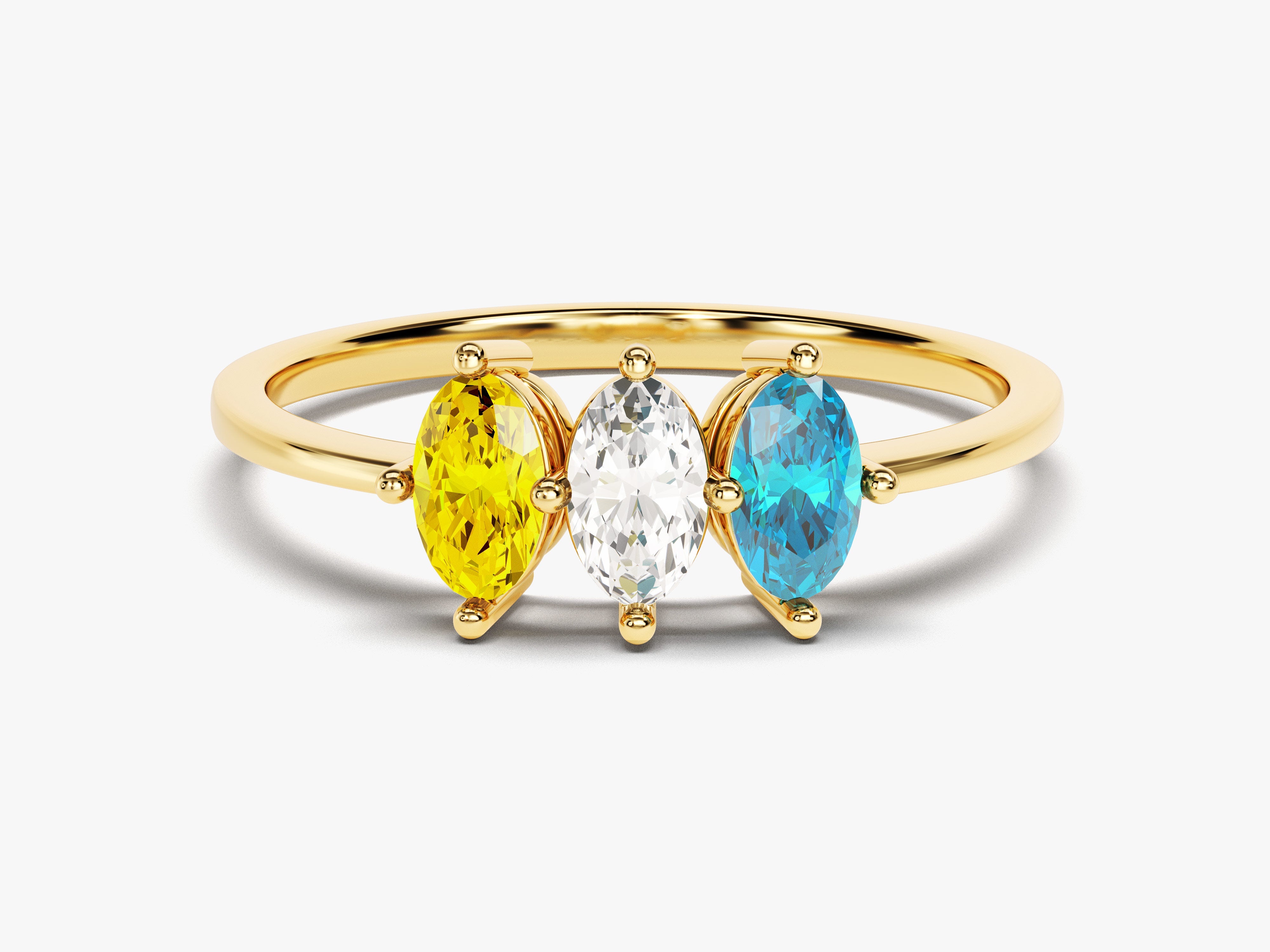 Gold ring with three marquise-cut gemstones: yellow, white, and blue