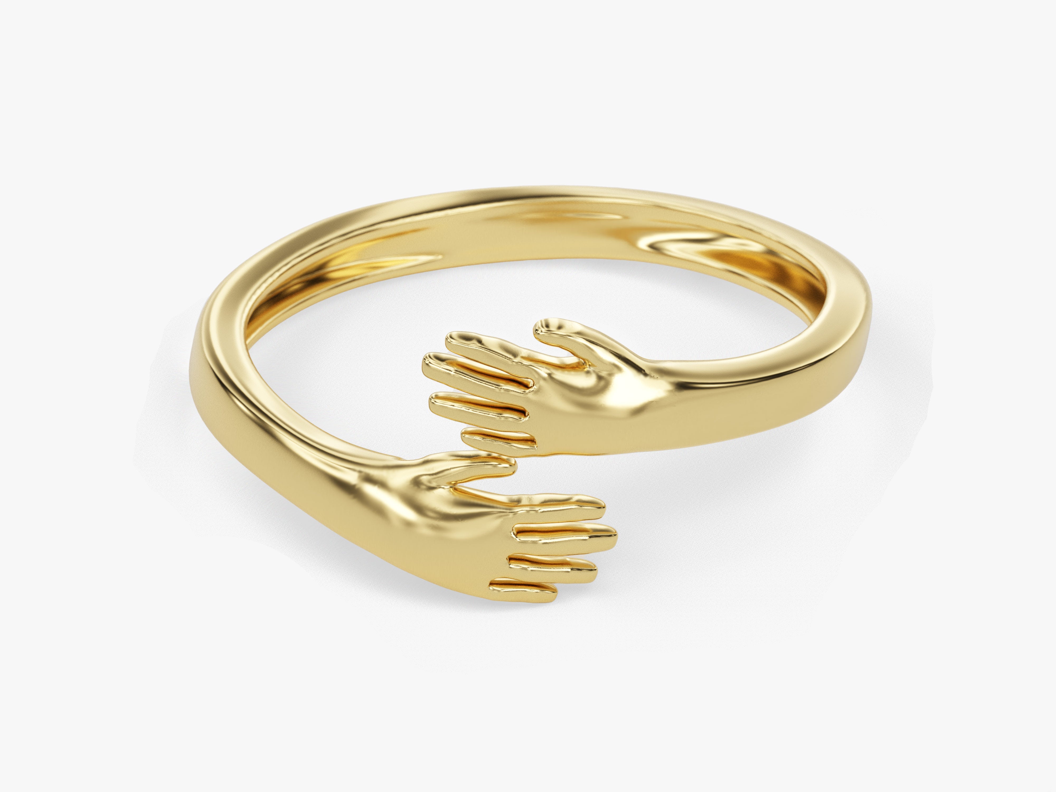 Gold hug ring jewelry with embracing hands design