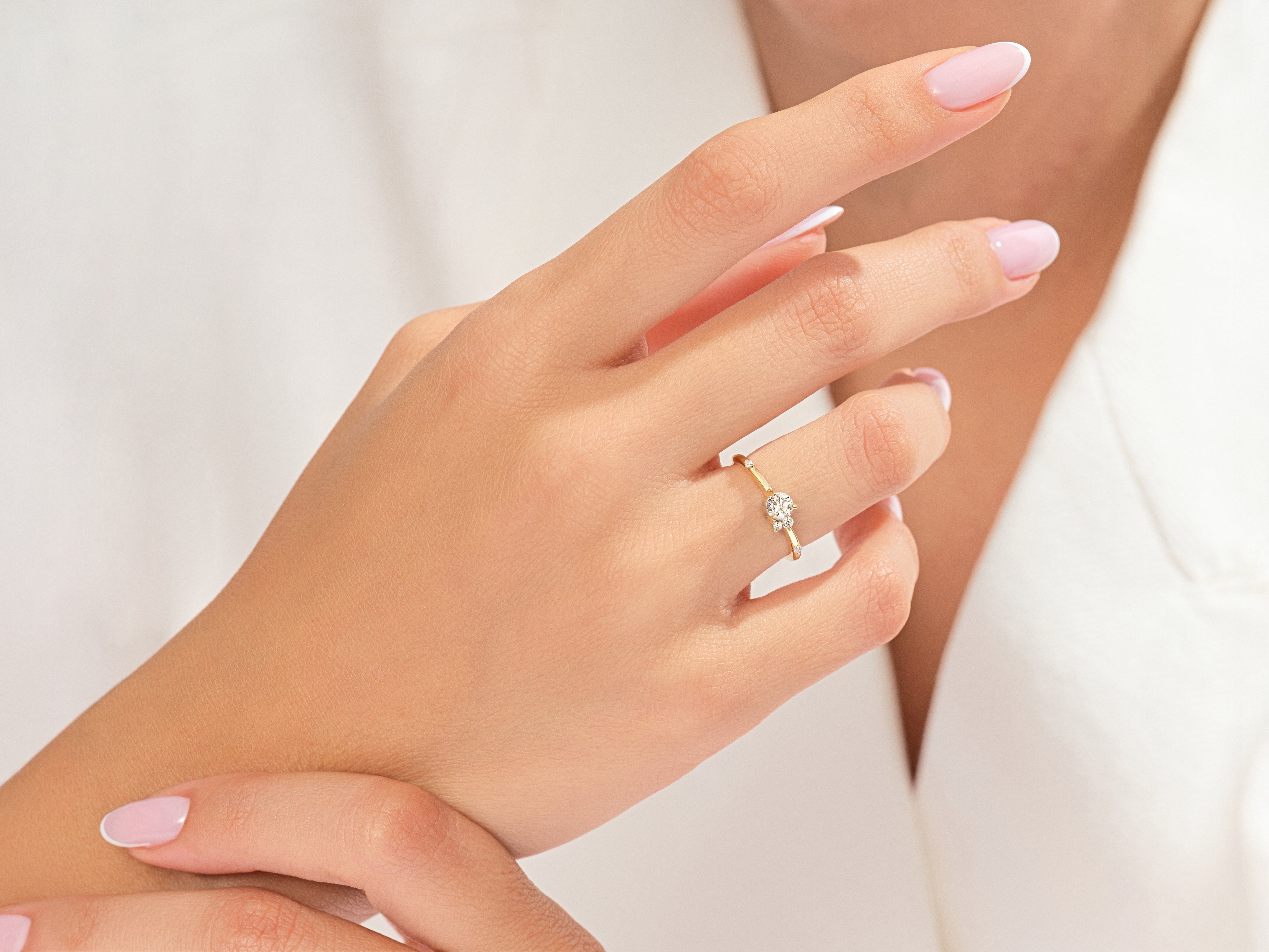 Diamond engagement ring on a woman's finger