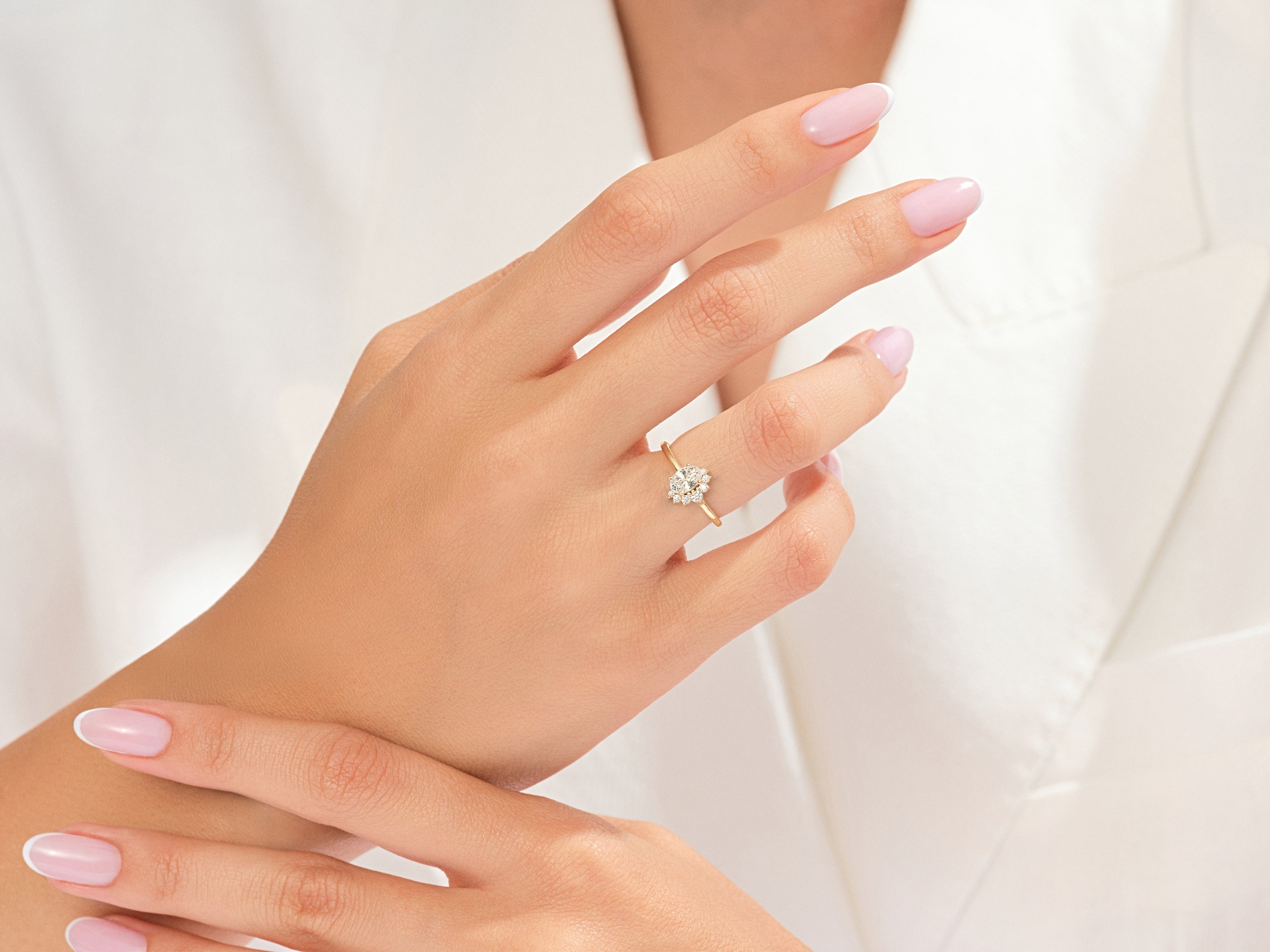 Gold diamond ring on a woman's hand, elegant jewelry