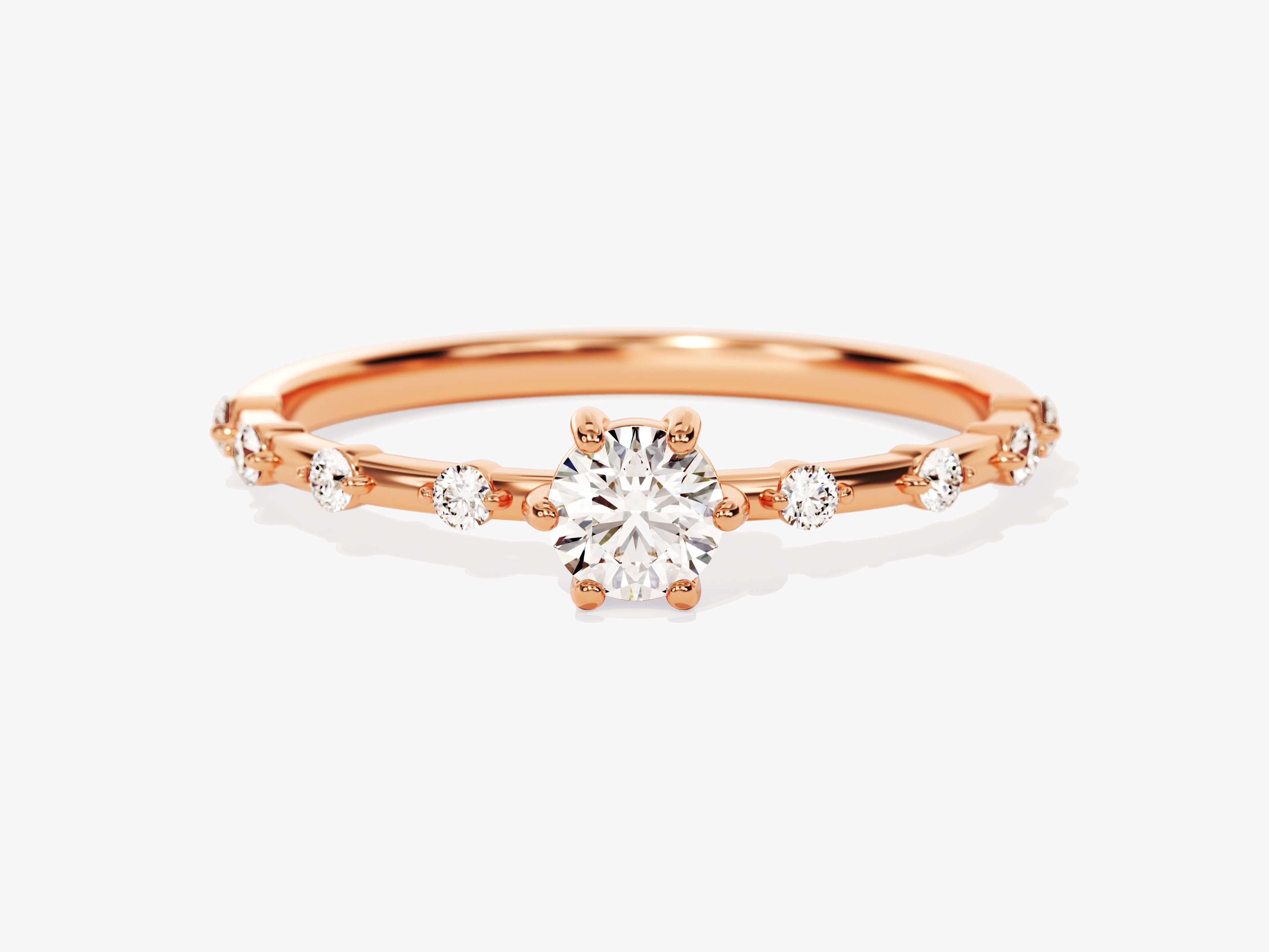 Rose gold diamond engagement ring with scattered stones