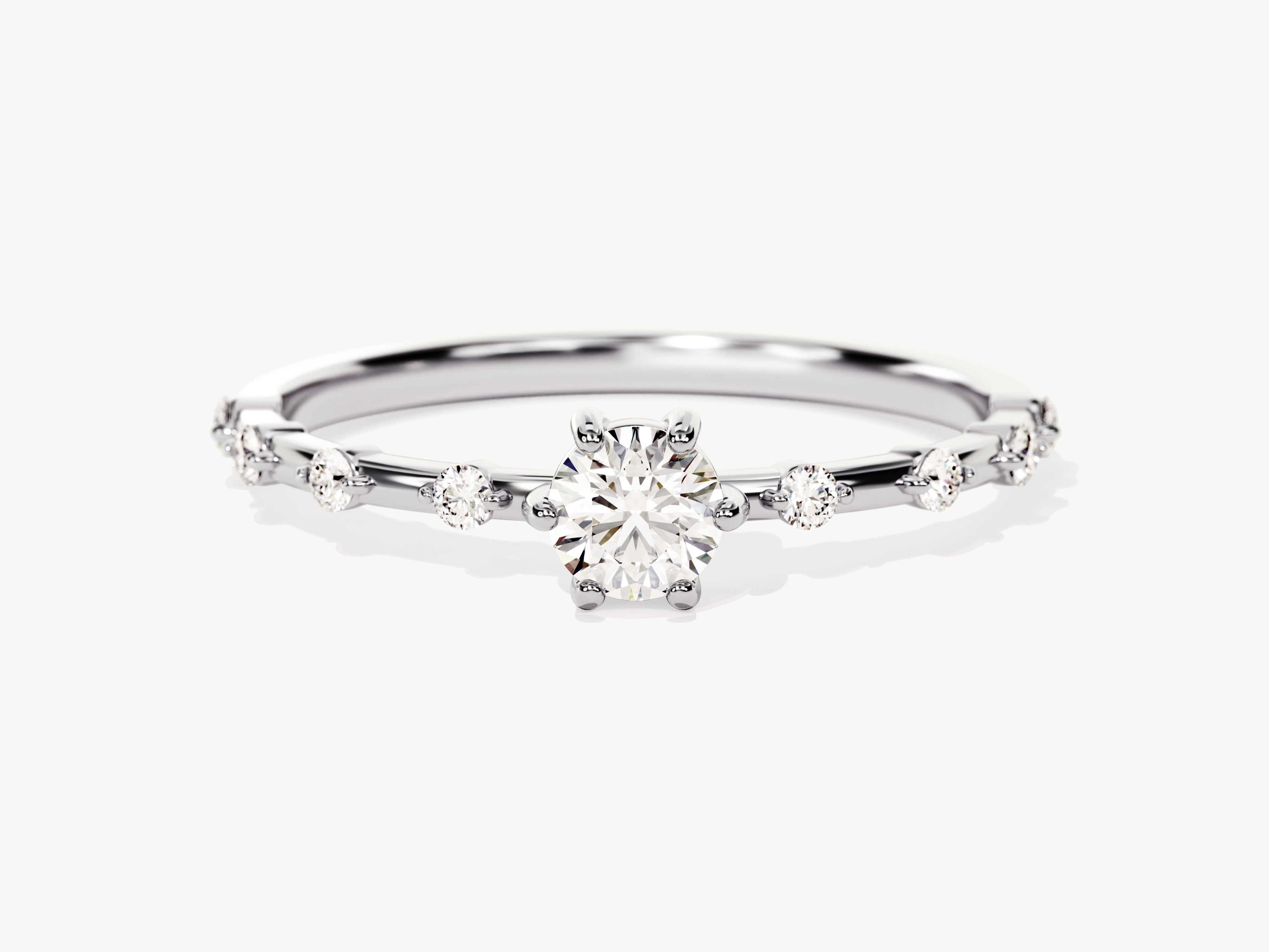 Diamond engagement ring with small accent stones on band