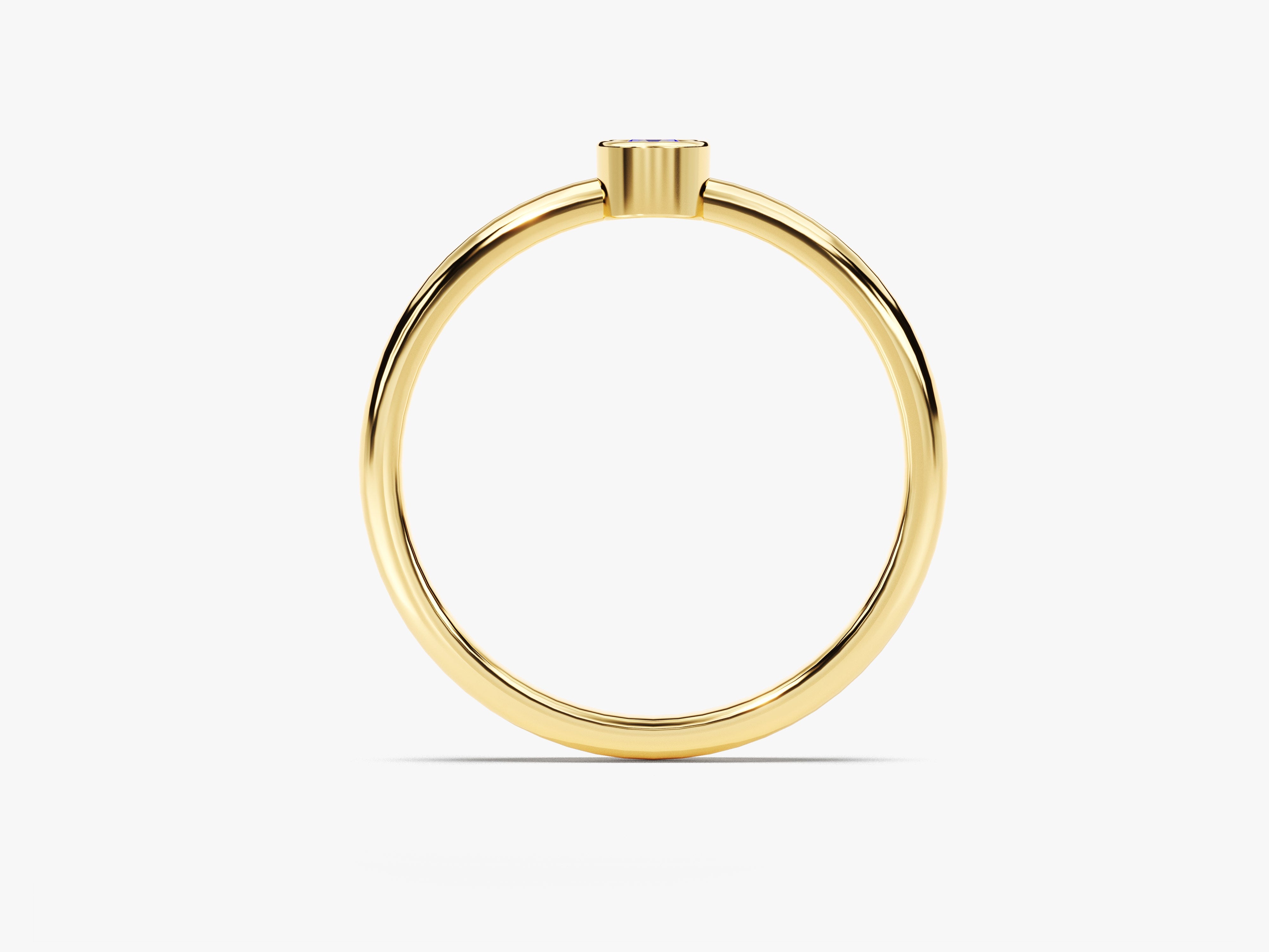 Minimalist gold ring with a single blue gemstone for jewelry lovers