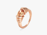 Gold ring with oval pink gemstone, jewelry design
