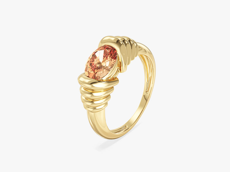 Gold ring with oval pink gemstone, jewelry design