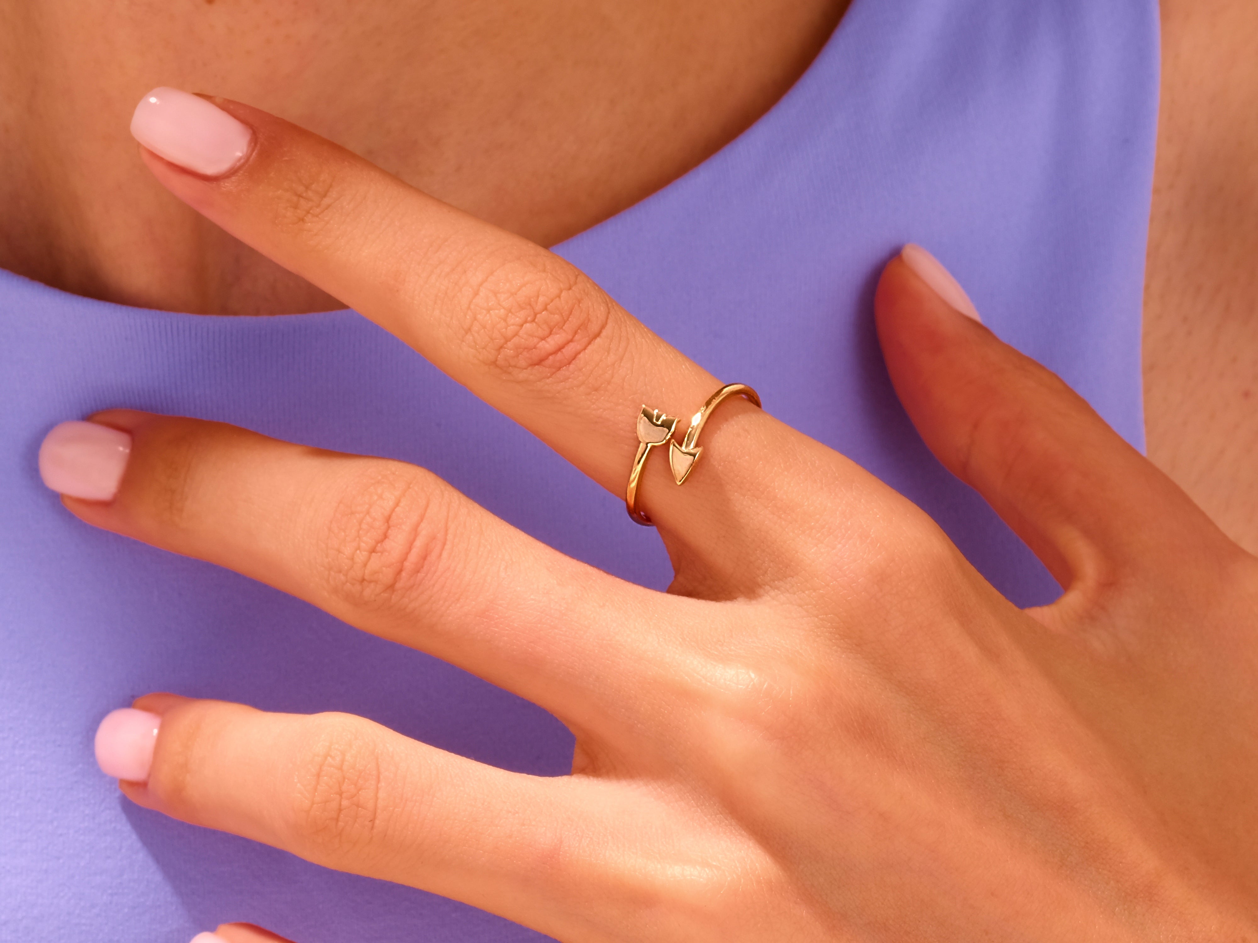 Gold tulip ring on a woman's finger, elegant jewelry for her
