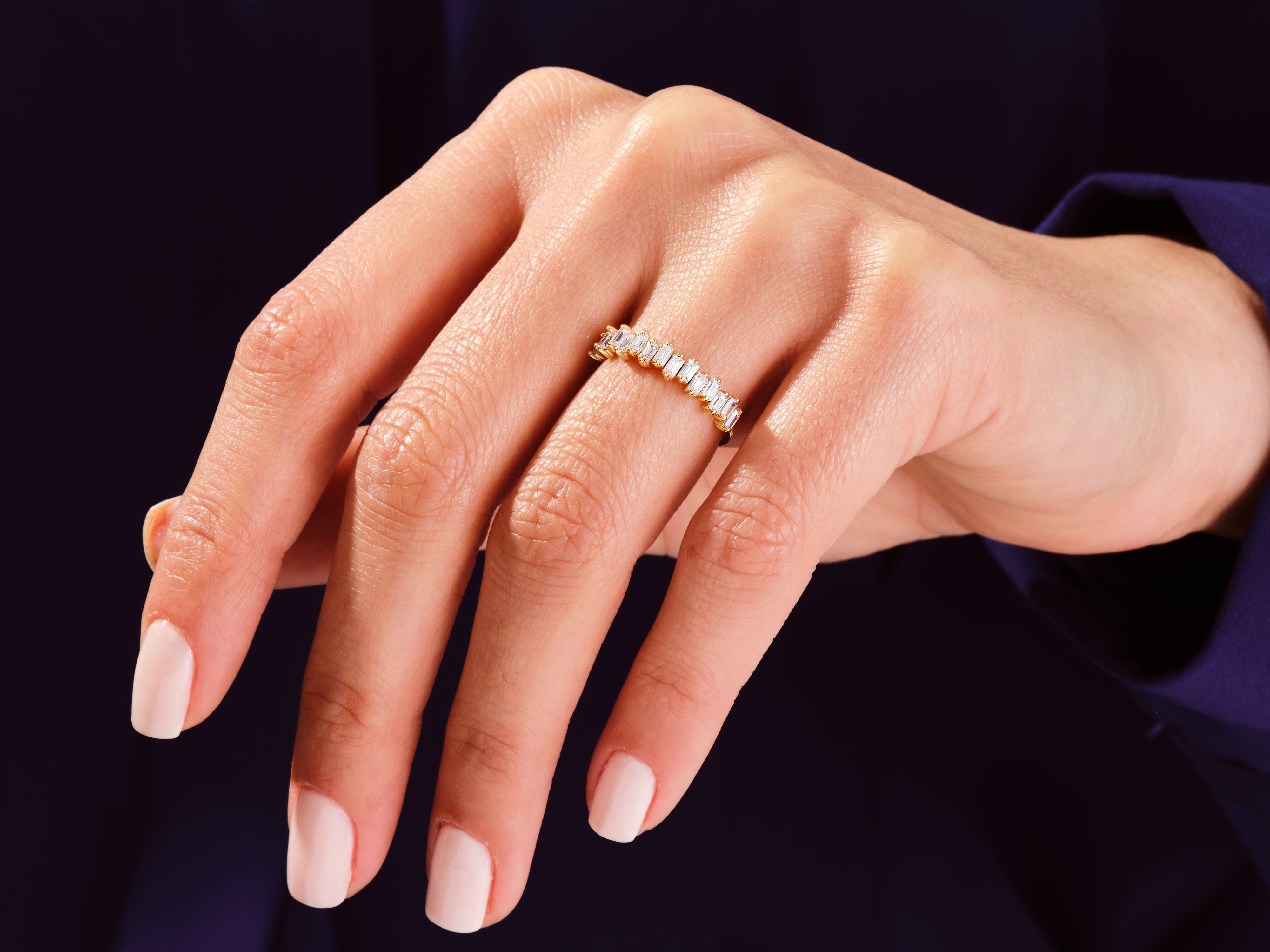 Diamond eternity ring on a woman's hand, luxury jewelry