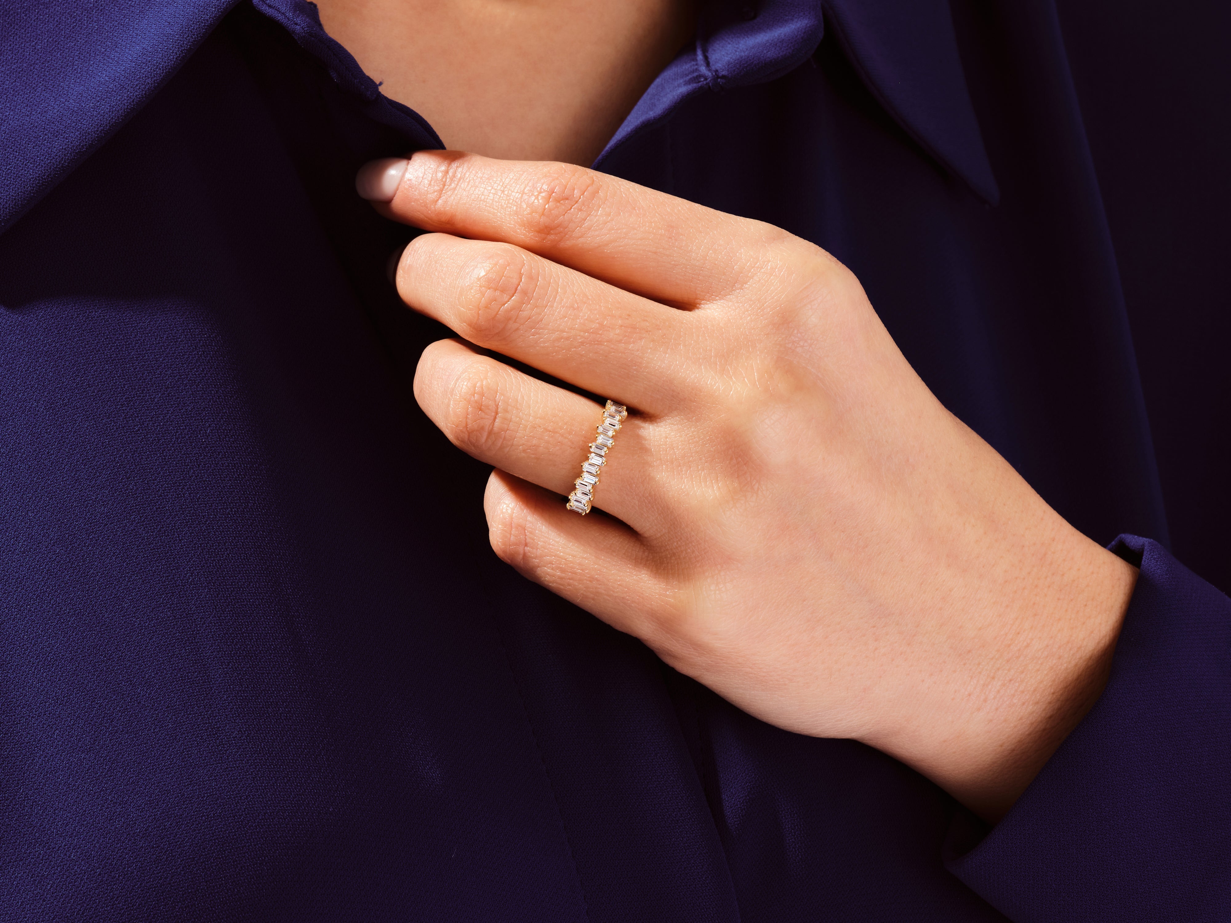 Diamond eternity ring on hand, luxury jewelry for women