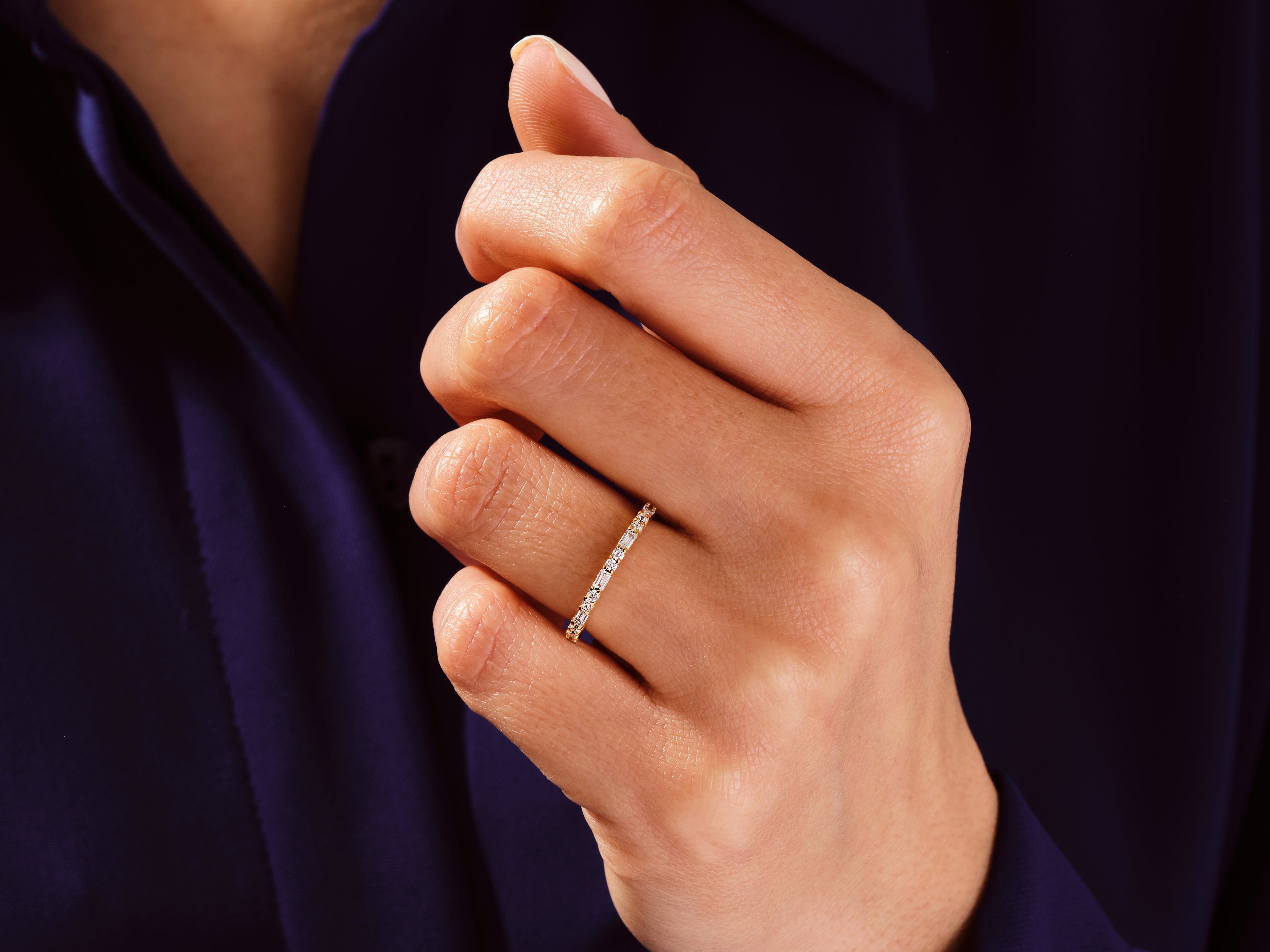 Diamond eternity ring on a hand, fine jewelry for women