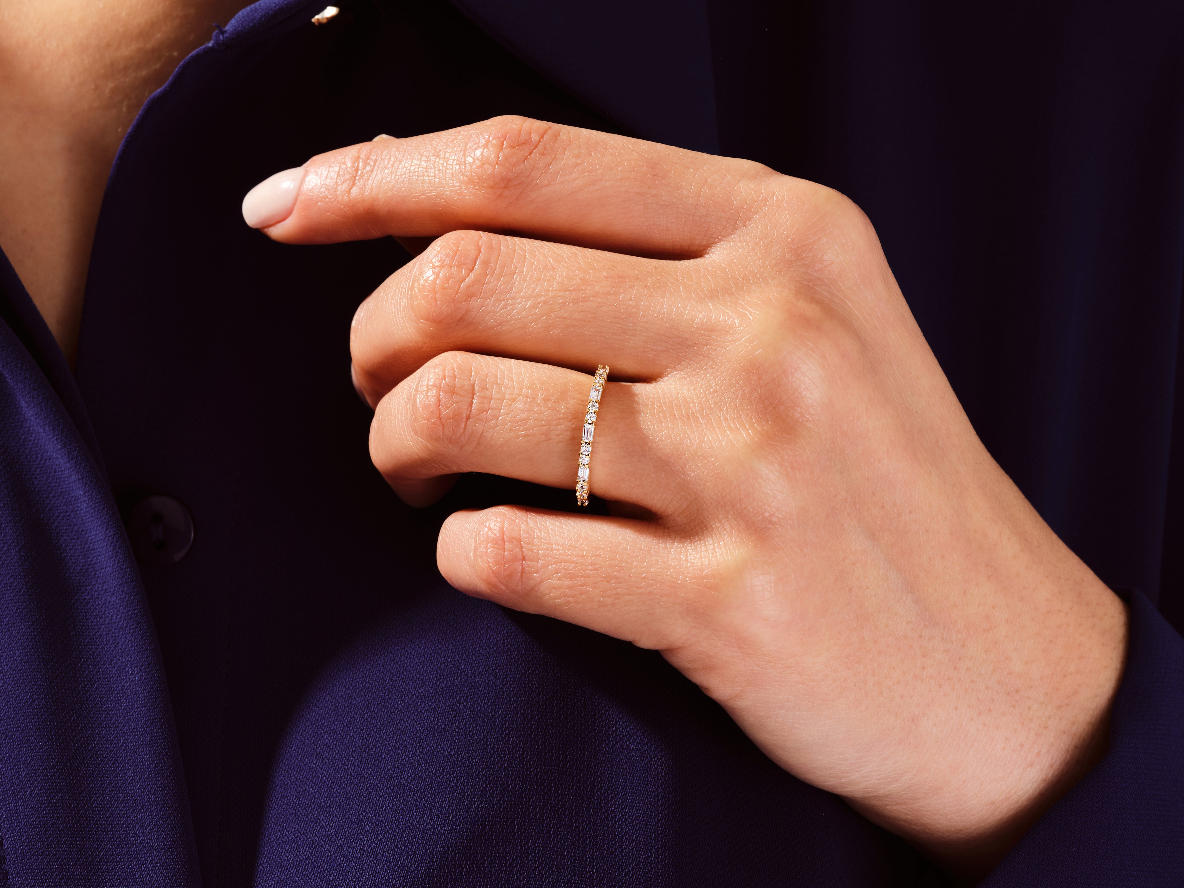 Diamond eternity ring on a hand, jewelry for women