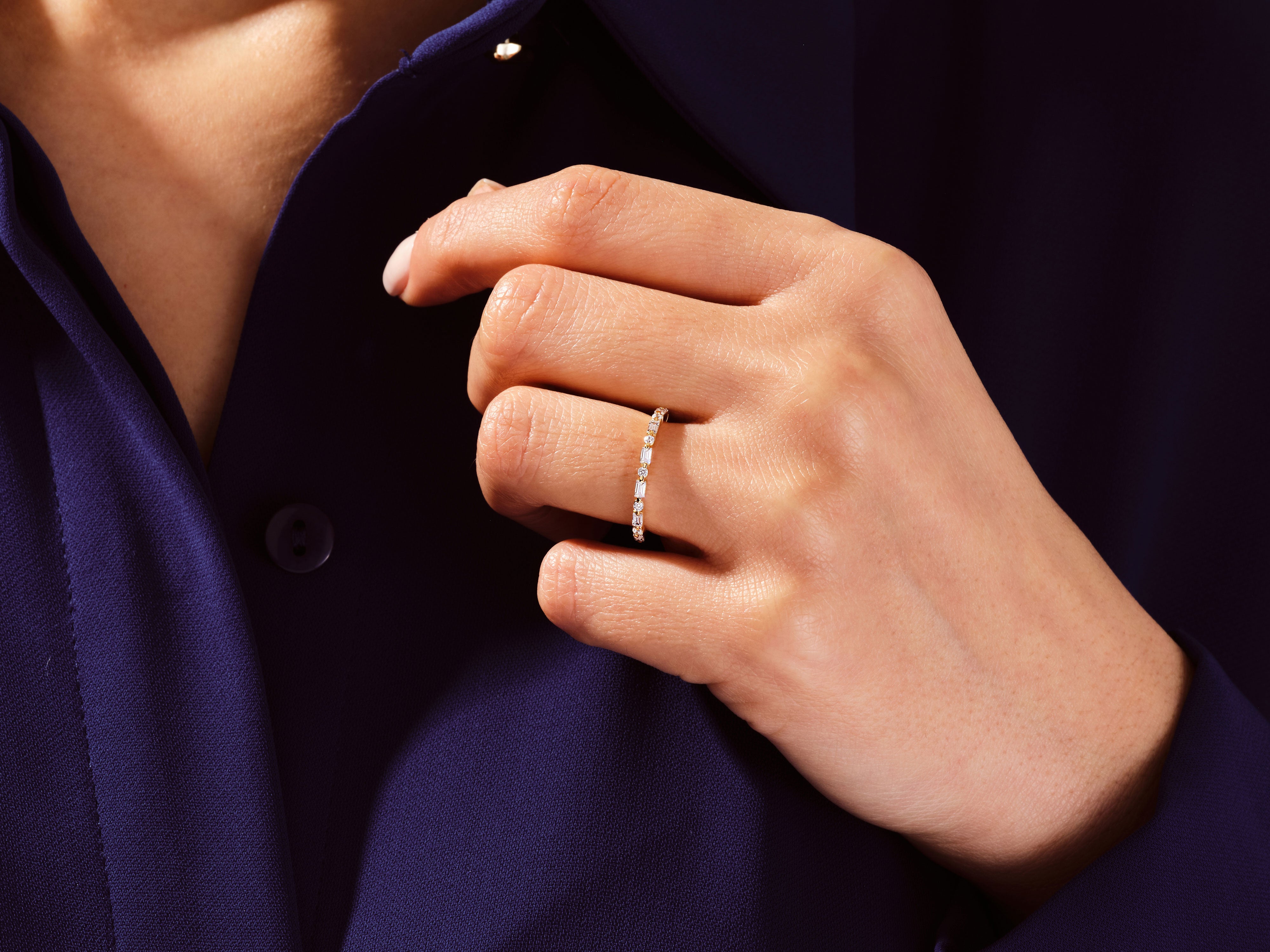 Diamond eternity ring on a hand, jewelry for her