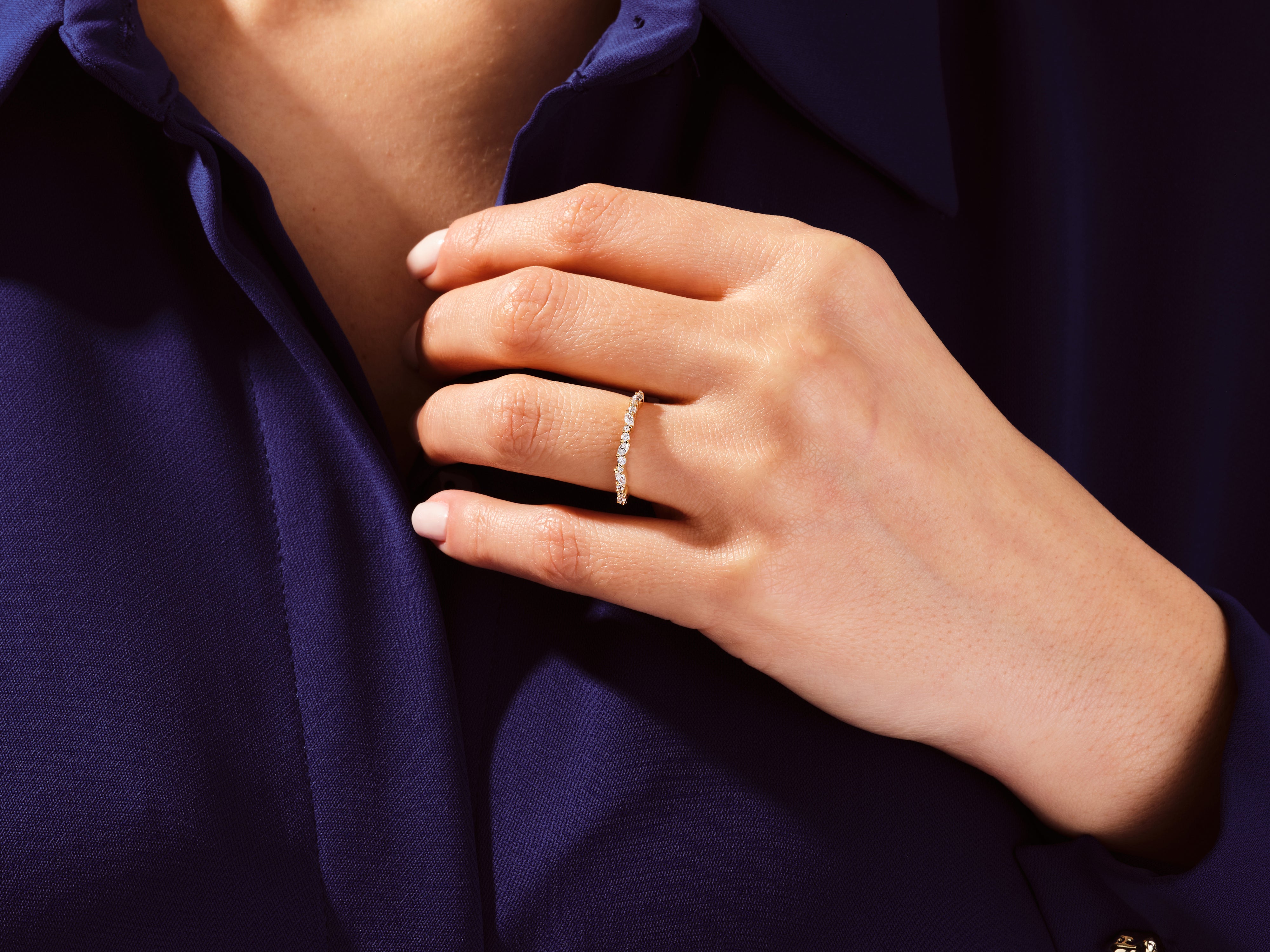 Diamond eternity ring on a woman's hand, fine jewelry