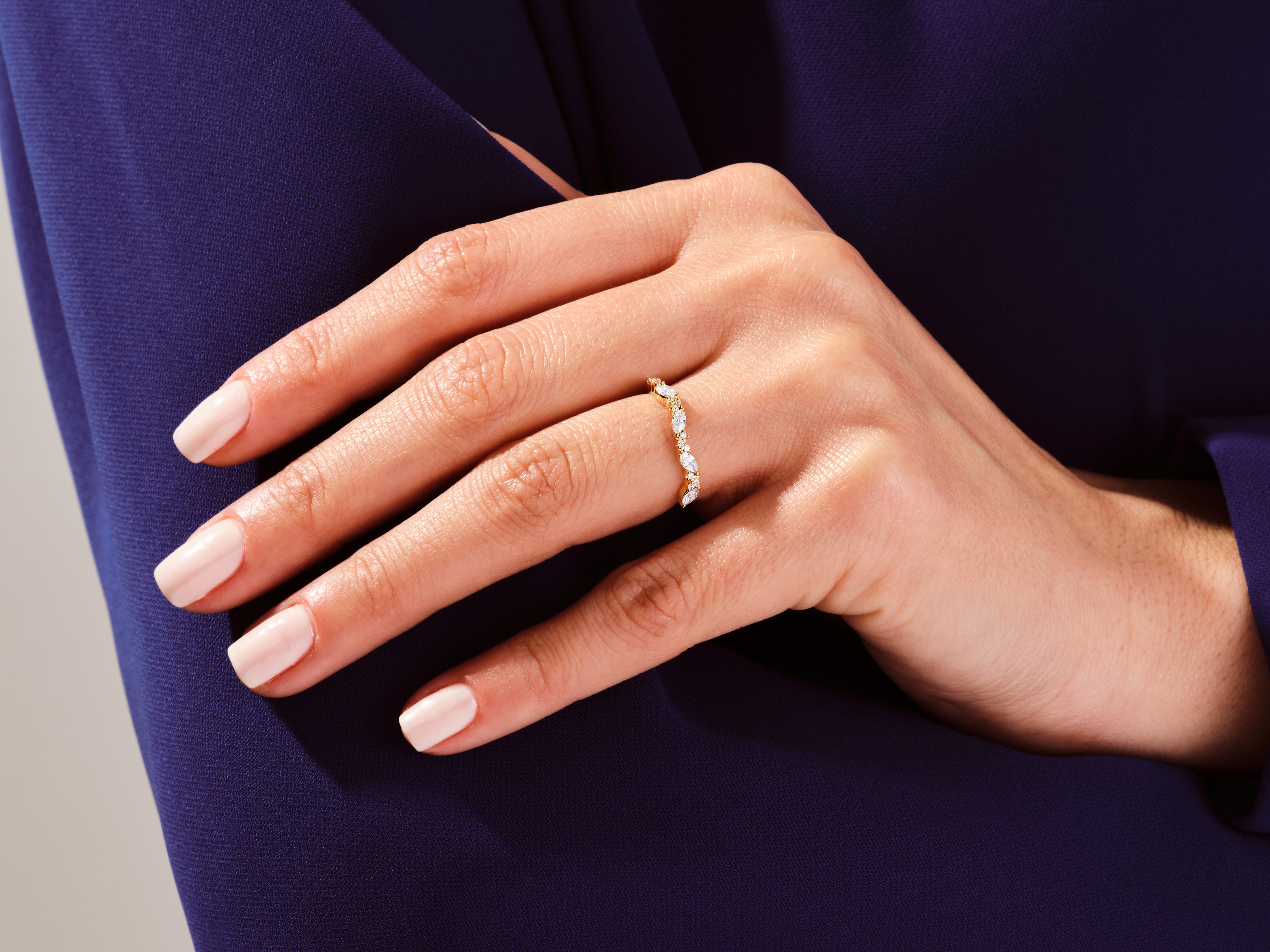 Diamond marquise band ring in gold on a hand