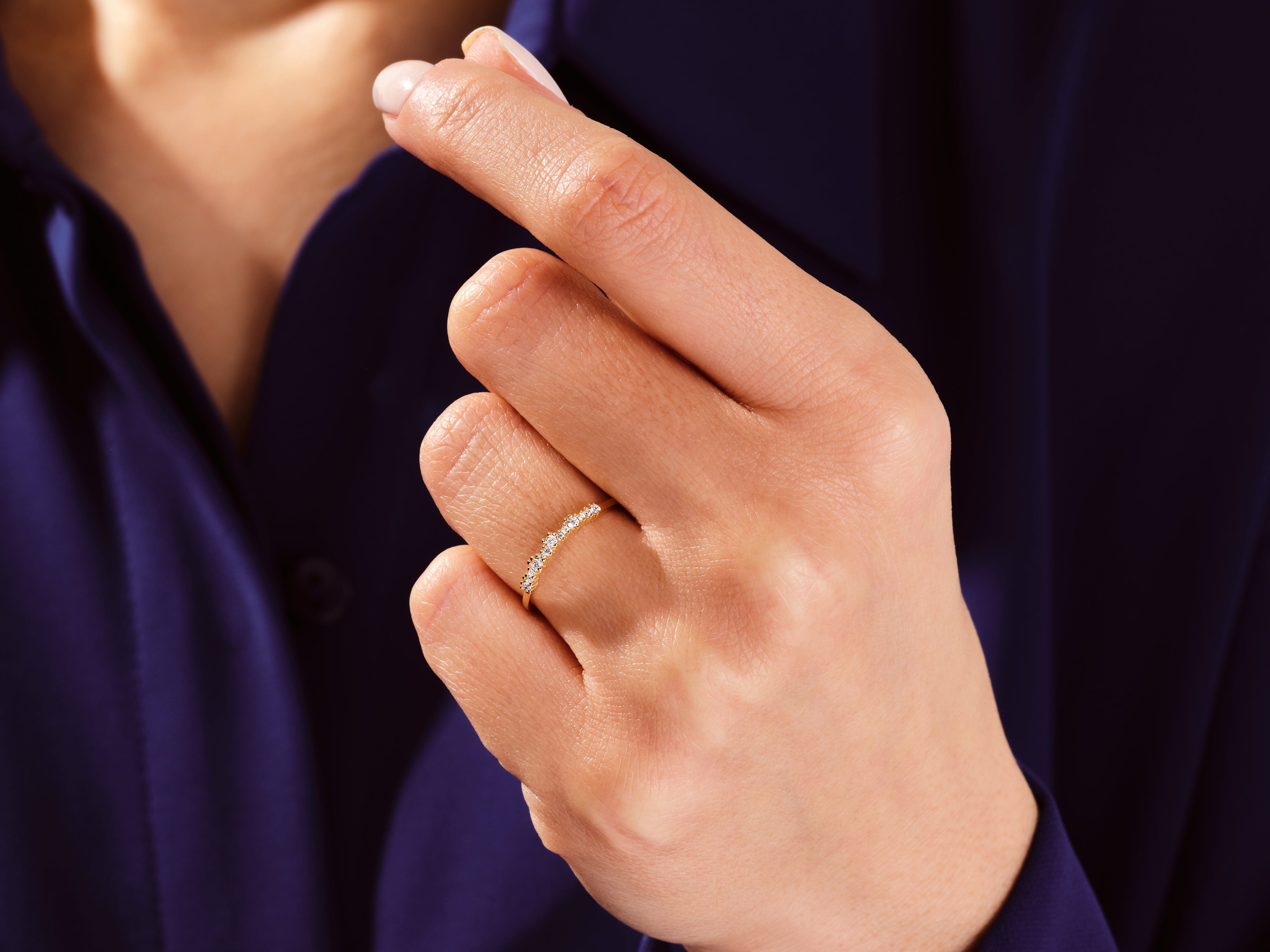 Gold diamond ring on a woman's finger, jewelry
