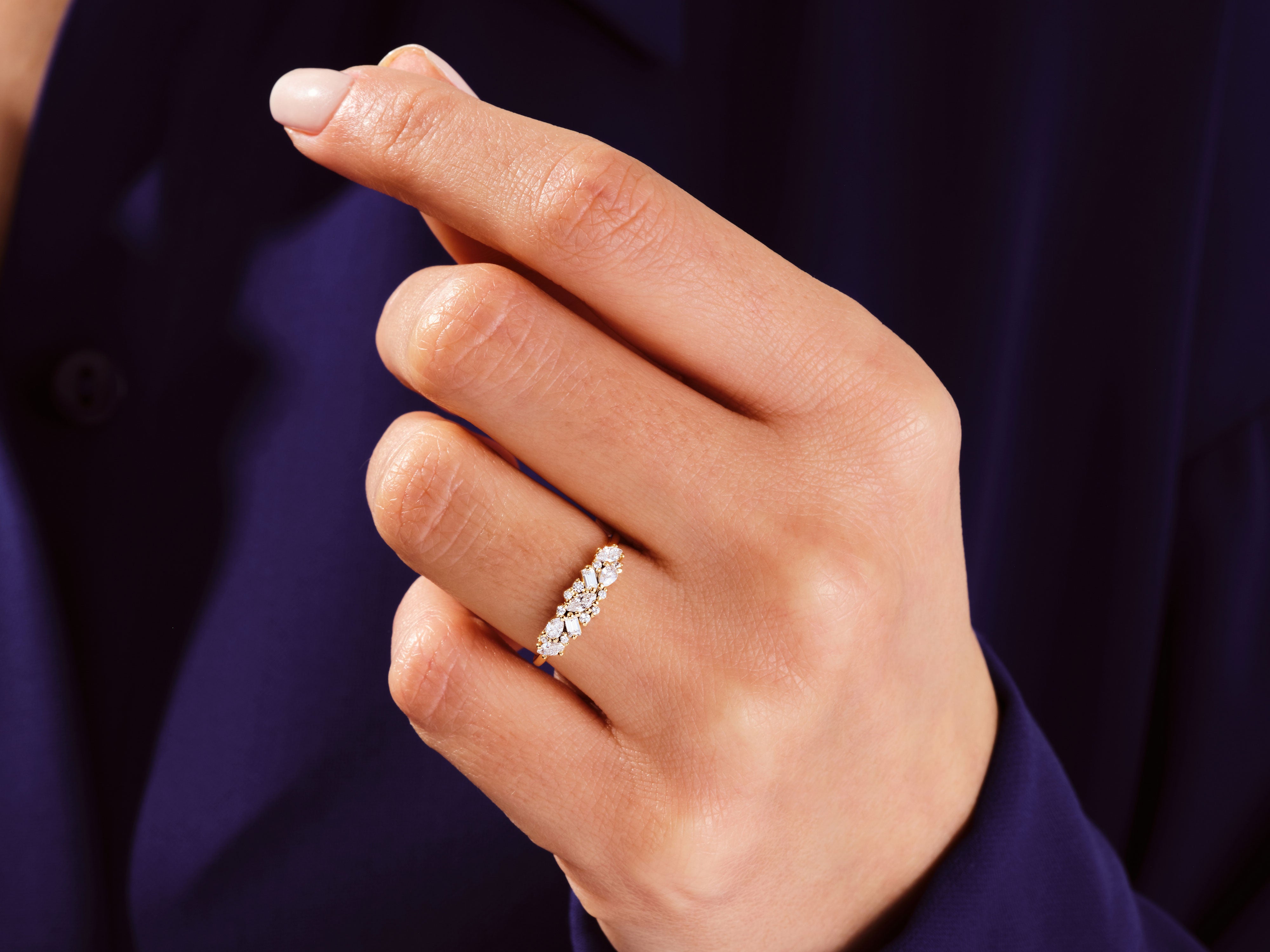 Diamond cluster ring on a hand, fine jewelry for women