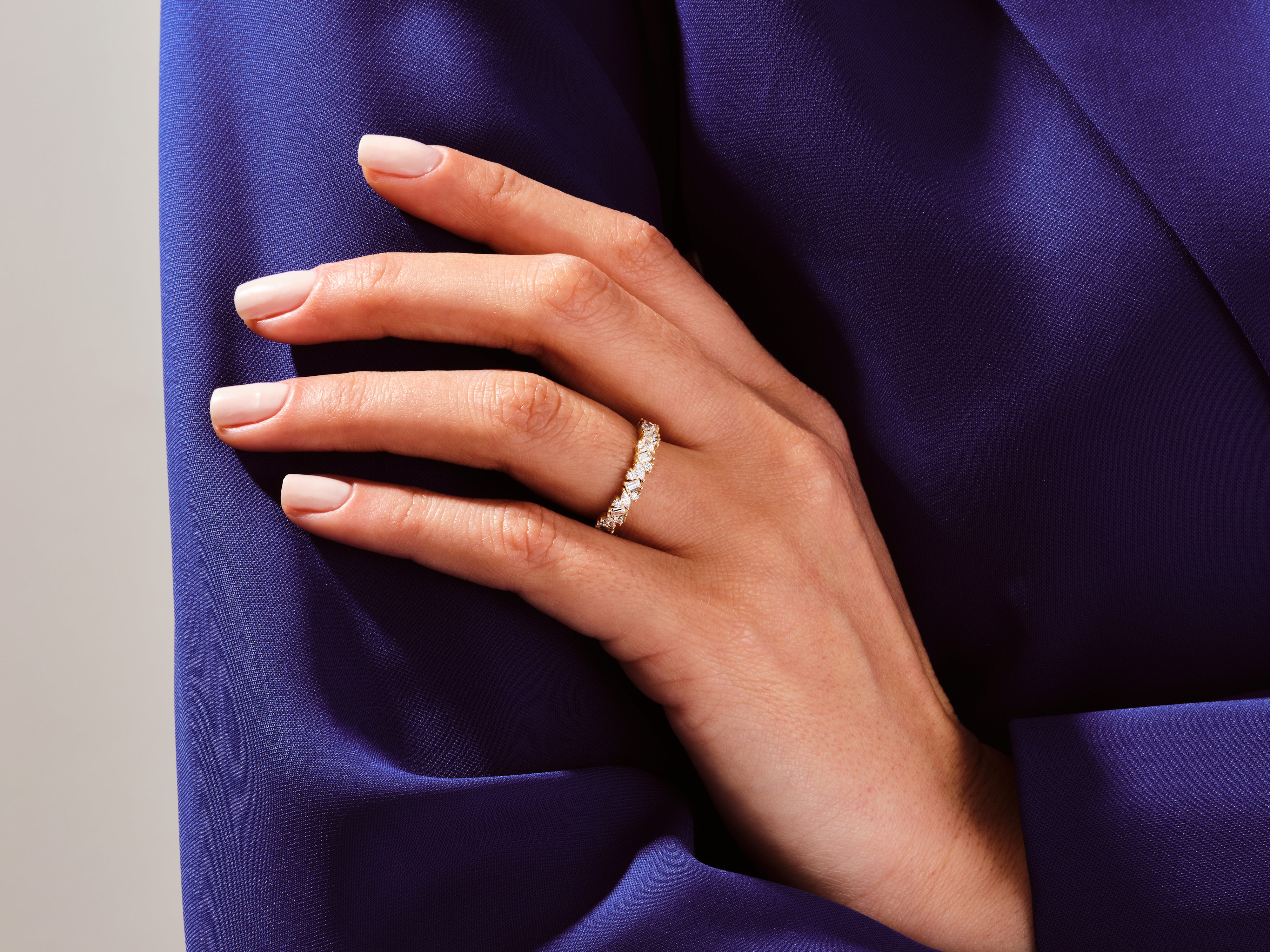 Diamond eternity ring on a hand, jewelry product photography