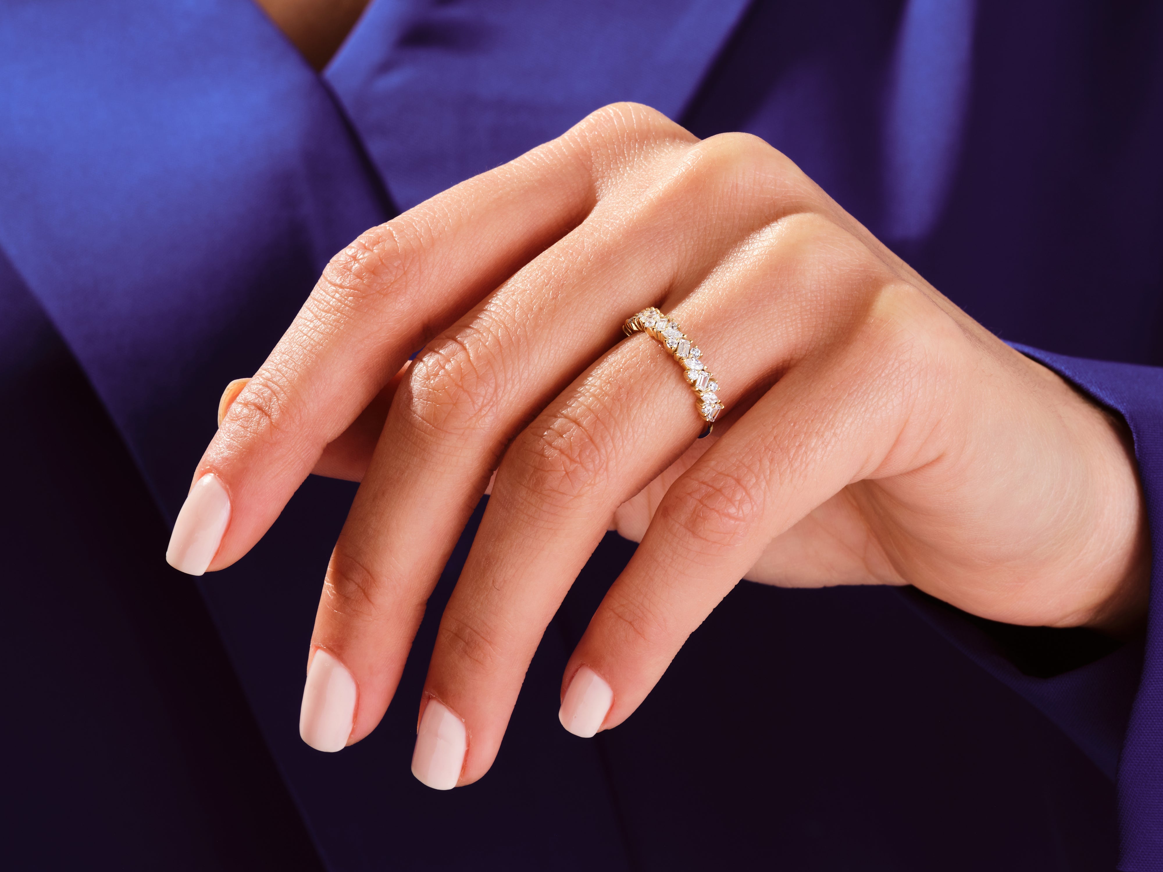 Diamond eternity ring on a hand, jewelry product photography